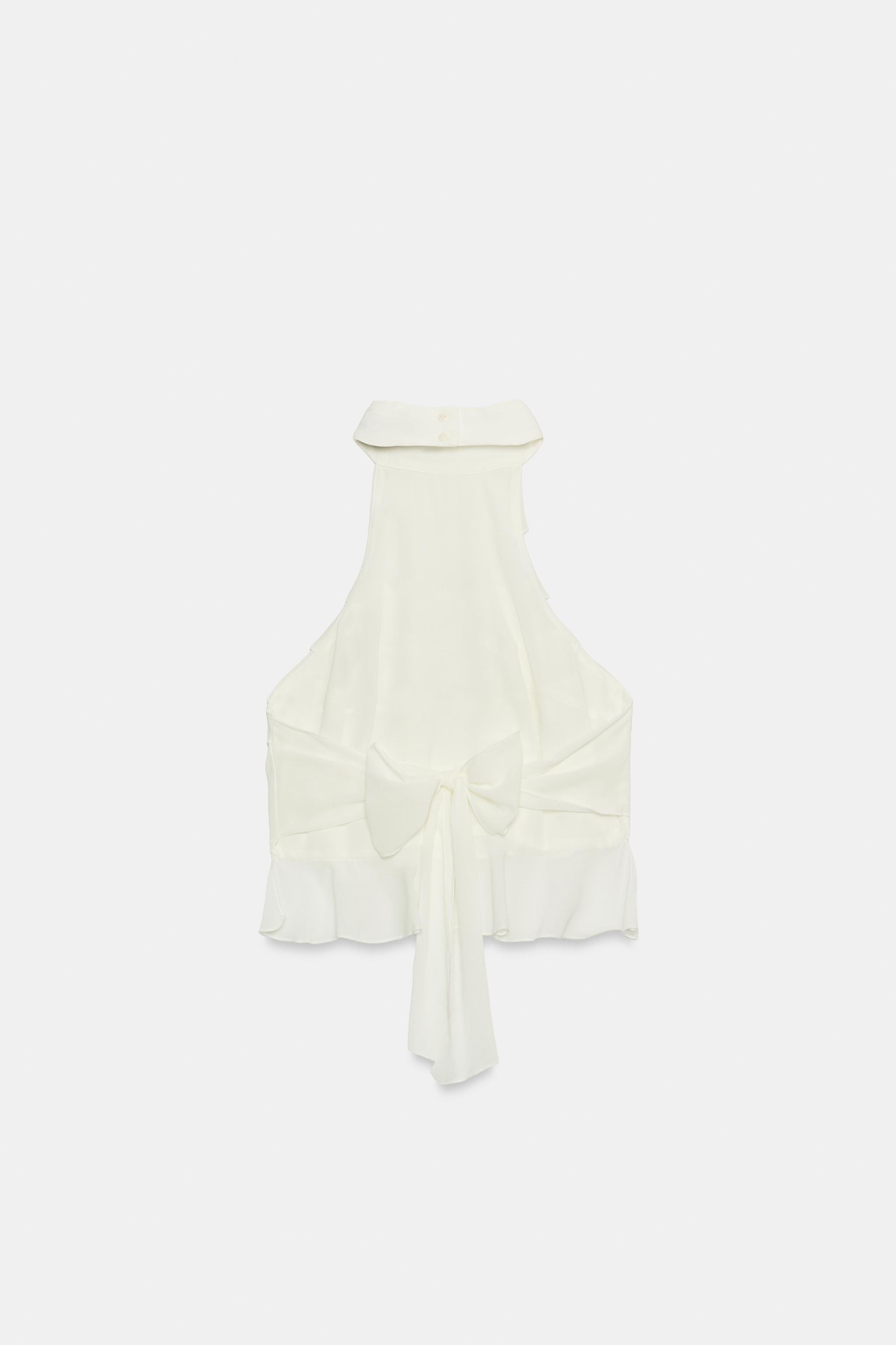 Model height: 181 cmHalter top. Ruffle detail. Open back with tie closure and button fastening at... | Zara Canada