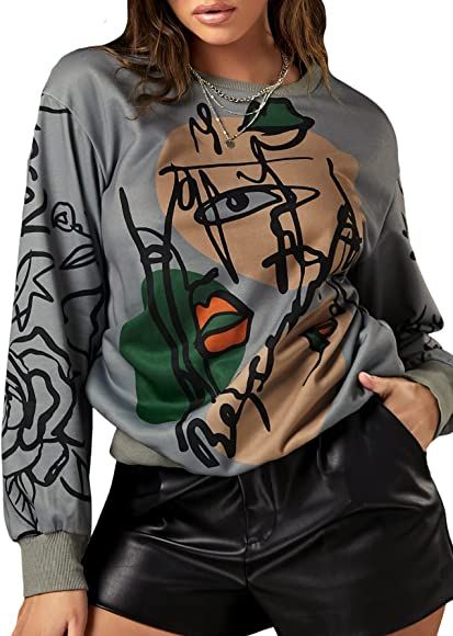 WDIRARA Women's Figure Graphic Print Sweatshirt Round Neck Long Sleeve Contrast Color Graffiti Pu... | Amazon (US)