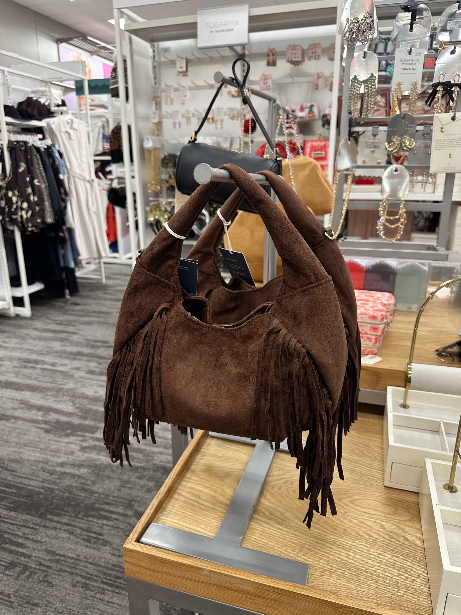 The cutest suede fringe purse from Target is only $30 🤎✨ The perfect western-inspired accessory to elevate any outfit—casual days, date nights, or styled with boots for a fun look. Such a good find for the price! Shop it now before it sells out 👜🤠

#LTKFindsUnder50 #LTKGiftGuide #LTKdayinmylife