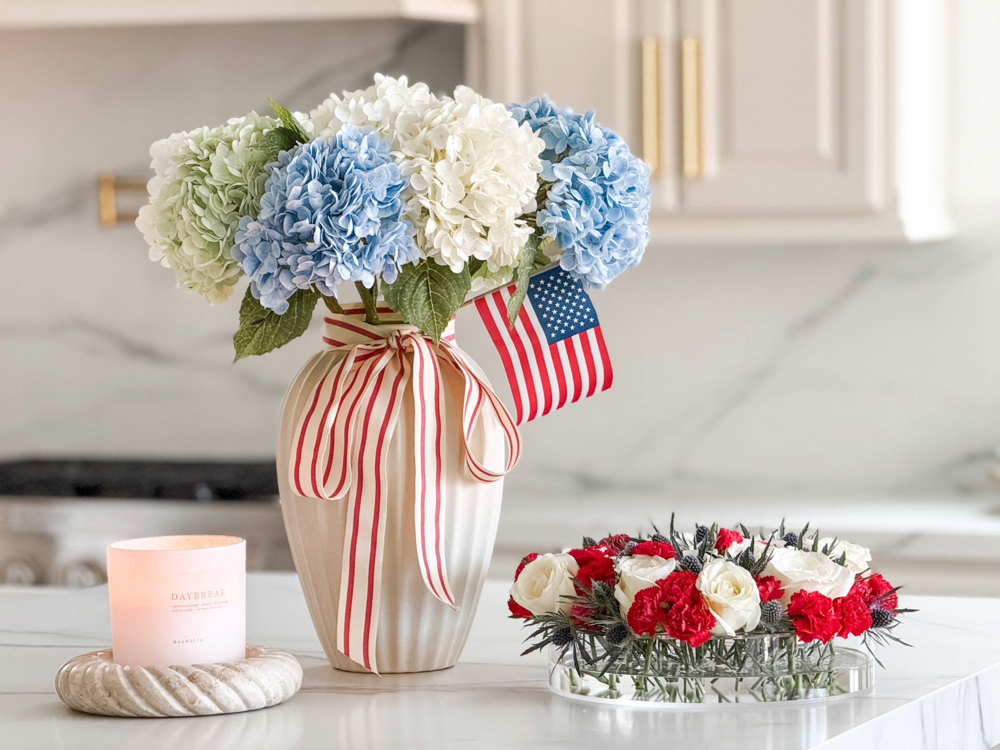 4th of July Floral

faux hydrangeas blue, red stripe ribbon, small american flag, 4th of july floral arrangement, low acrylic vase, stone tray, beige white gray 

 #LTKSummerEdit #LTKSeasonal #LTKHome