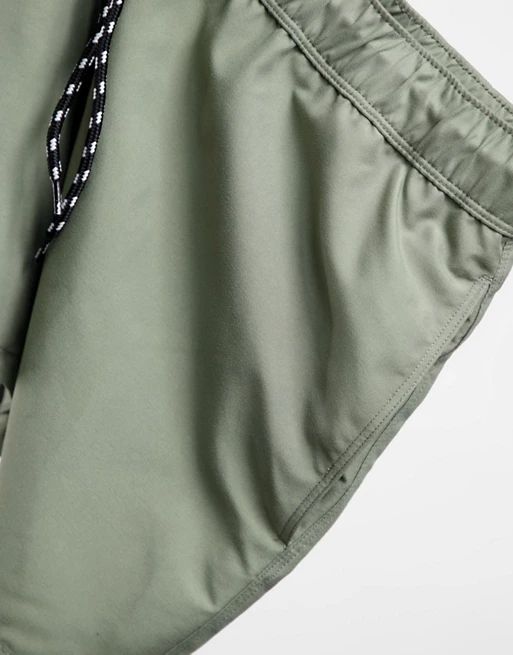 ASOS DESIGN swim shorts in khaki in short length | ASOS (Global)