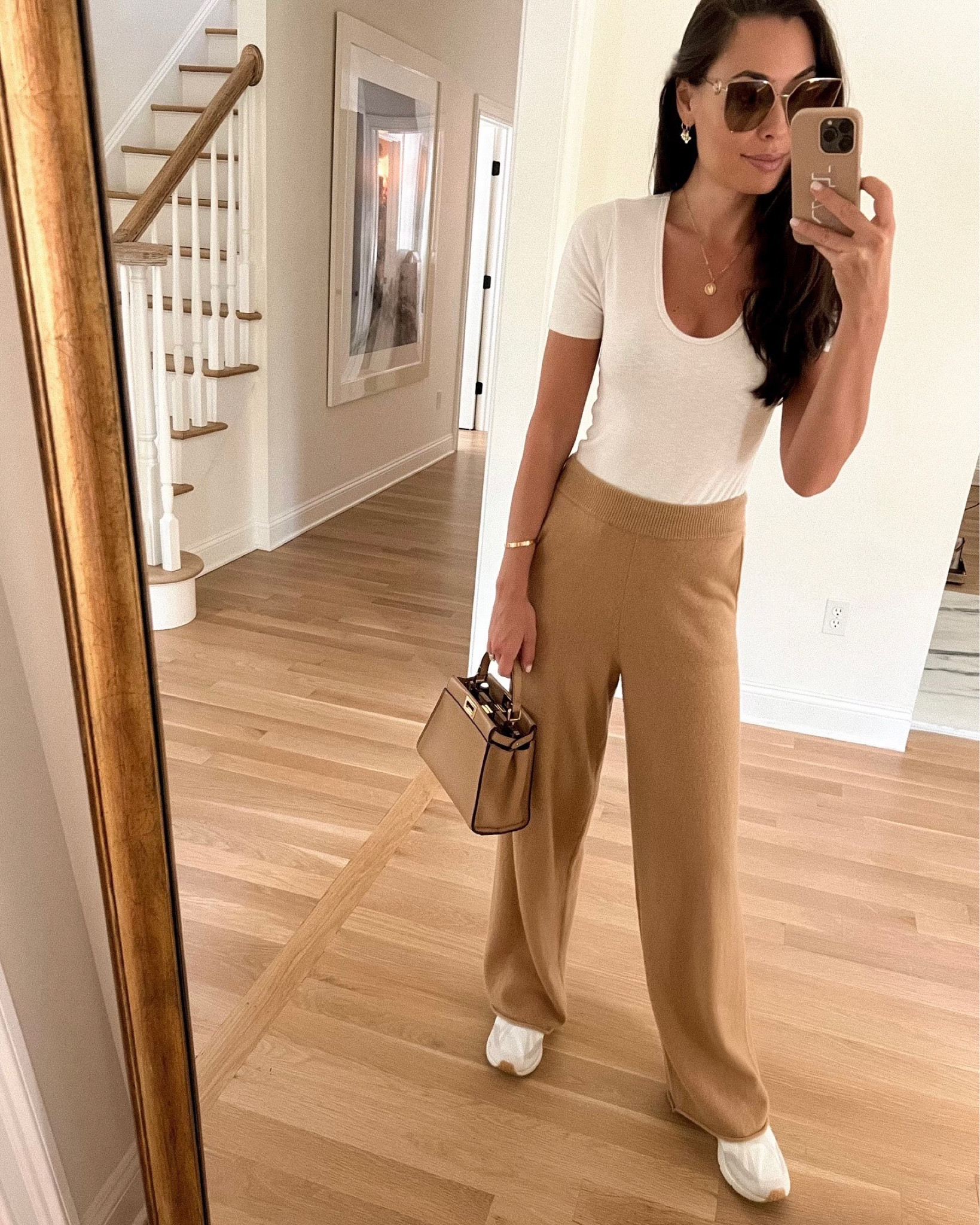 Kat Jamieson of With Love From Kat wears a fall outfit. Cashmere pants, bodysuit, Fendi peekaboo bag, sneaker style, casual. 

#LTKSeasonal #LTKitbag #LTKtravel