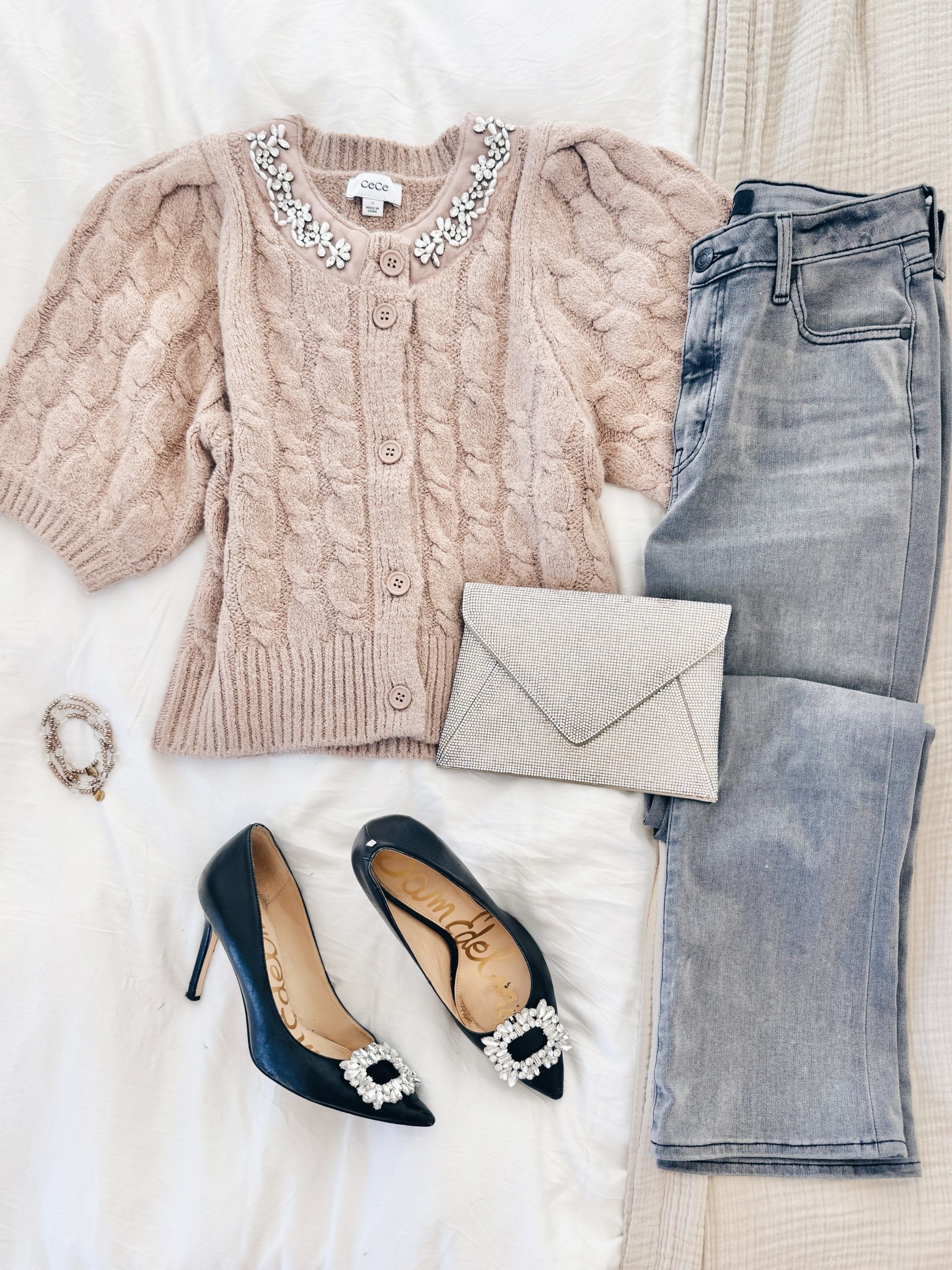 Instead of buying glam shoes for the holidays just buy these $10 clips that attach to any pumps or flats you already own. This sweater is on sale! 

#LTKFindsUnder50 #LTKHoliday #LTKSaleAlert