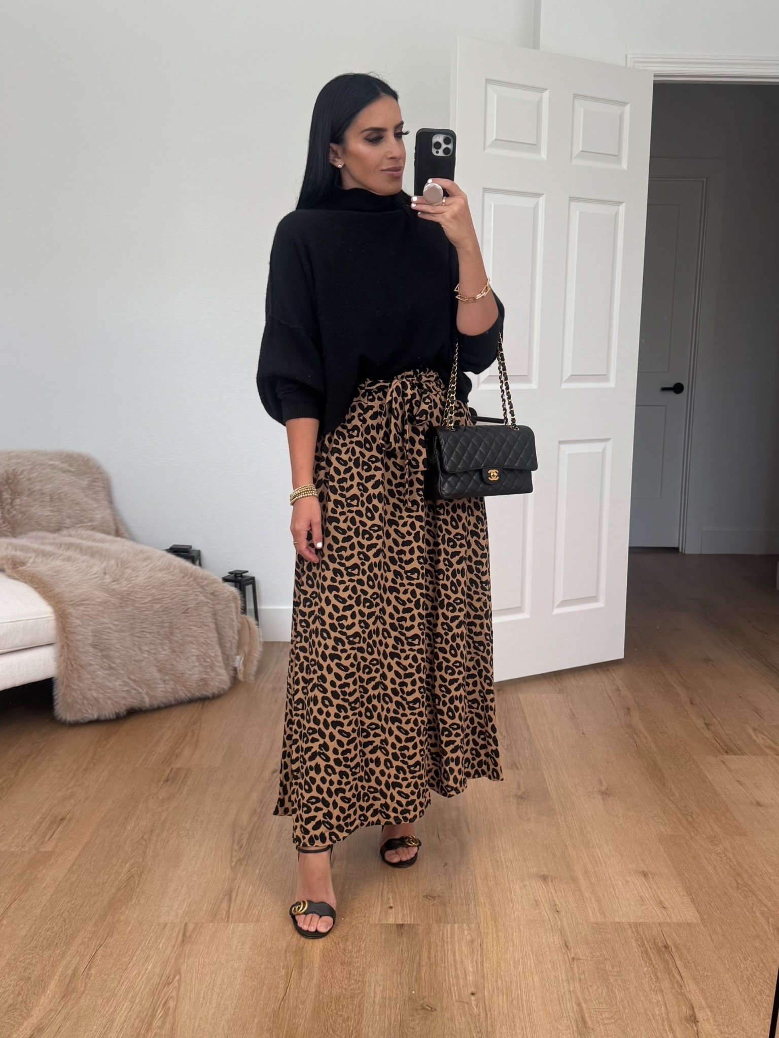 Leopard print mxi skirt from Amazon under $30. Black turtleneck sweater. Gucci heels