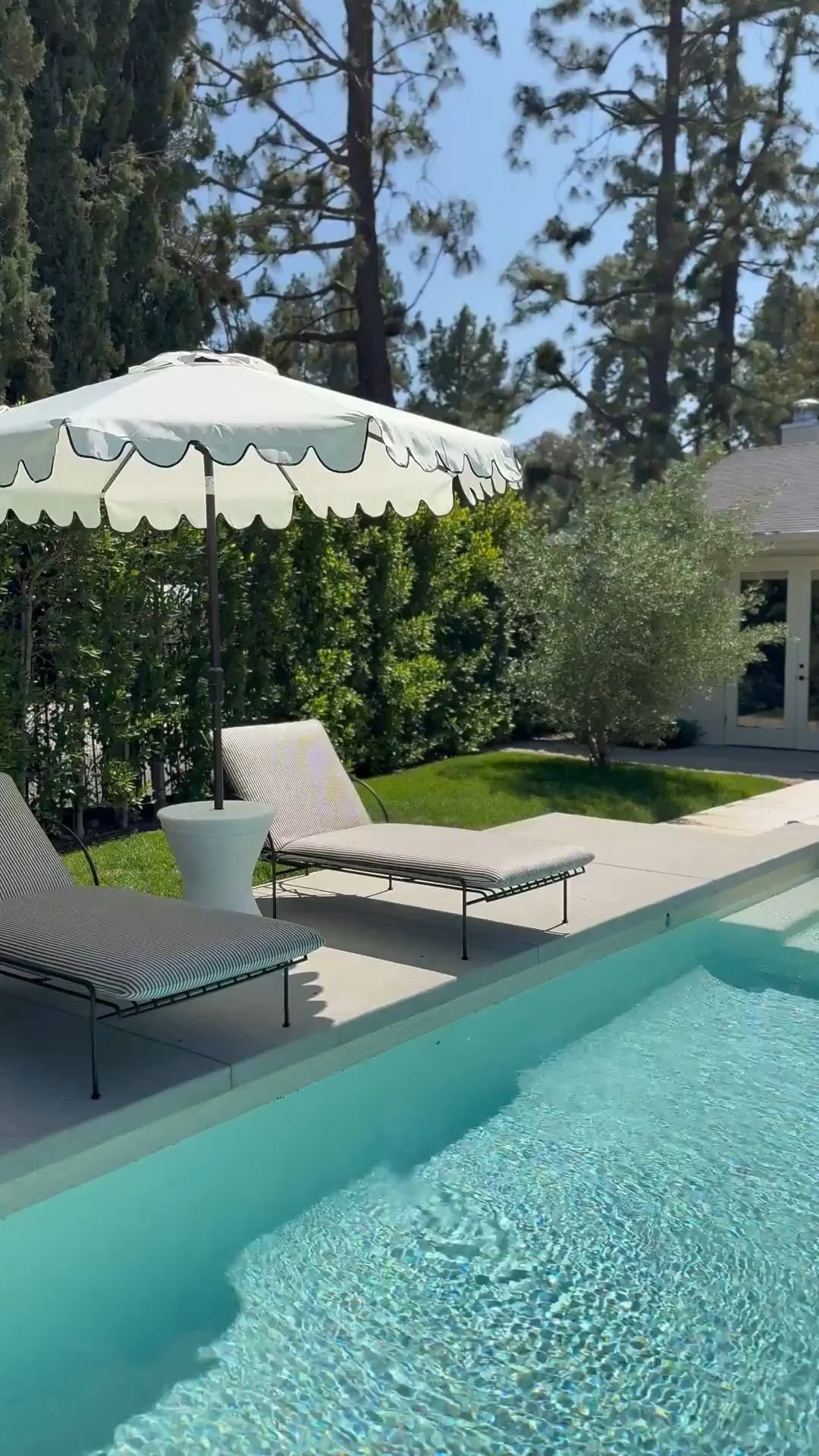 Pool loungers, scalloped patio umbrella, and umbrella table vase!





#LTKHome #LTKStyleTip