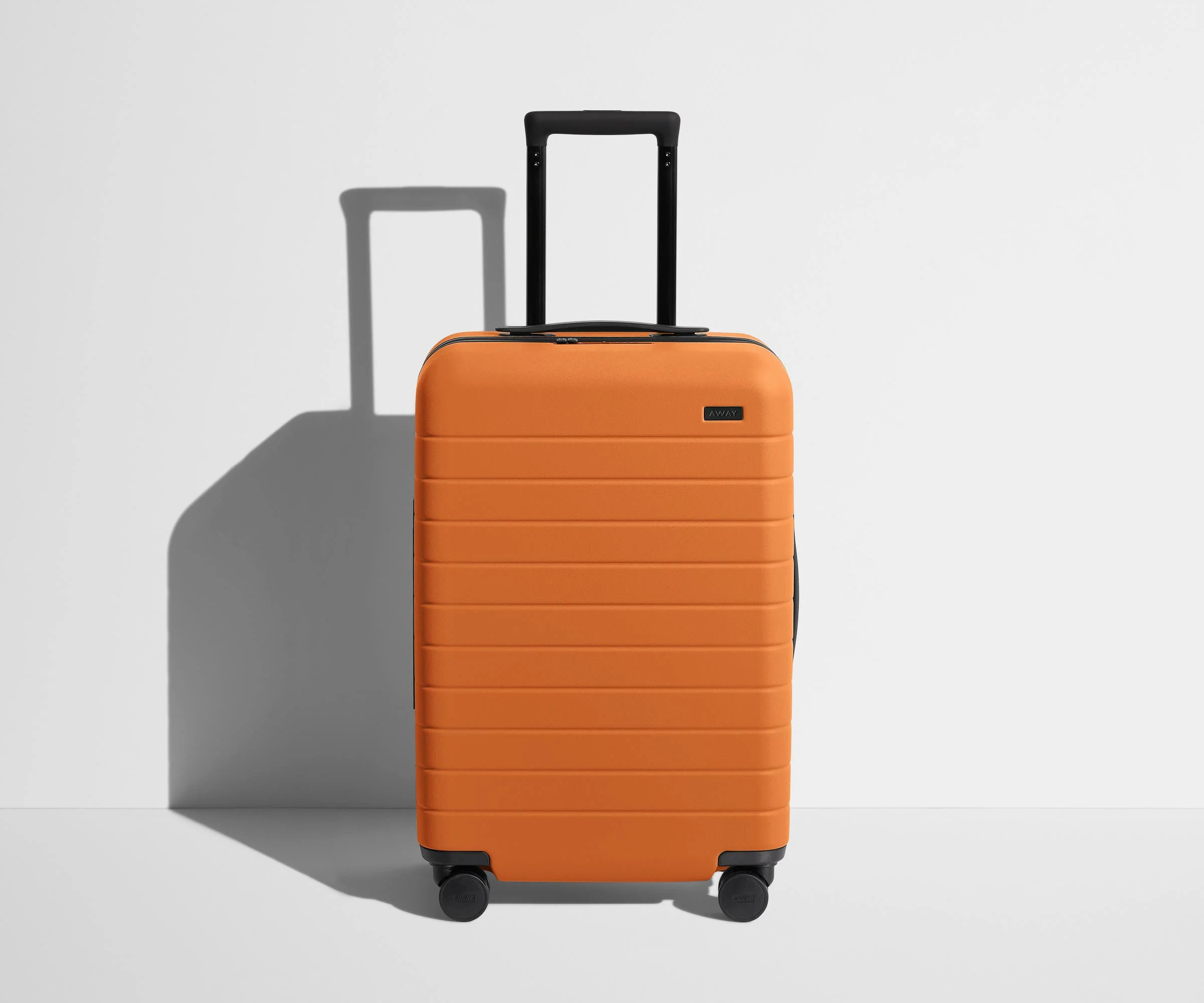 Shop The Bigger Carry-On suitcase in Sorbet Orange | Away | Away
