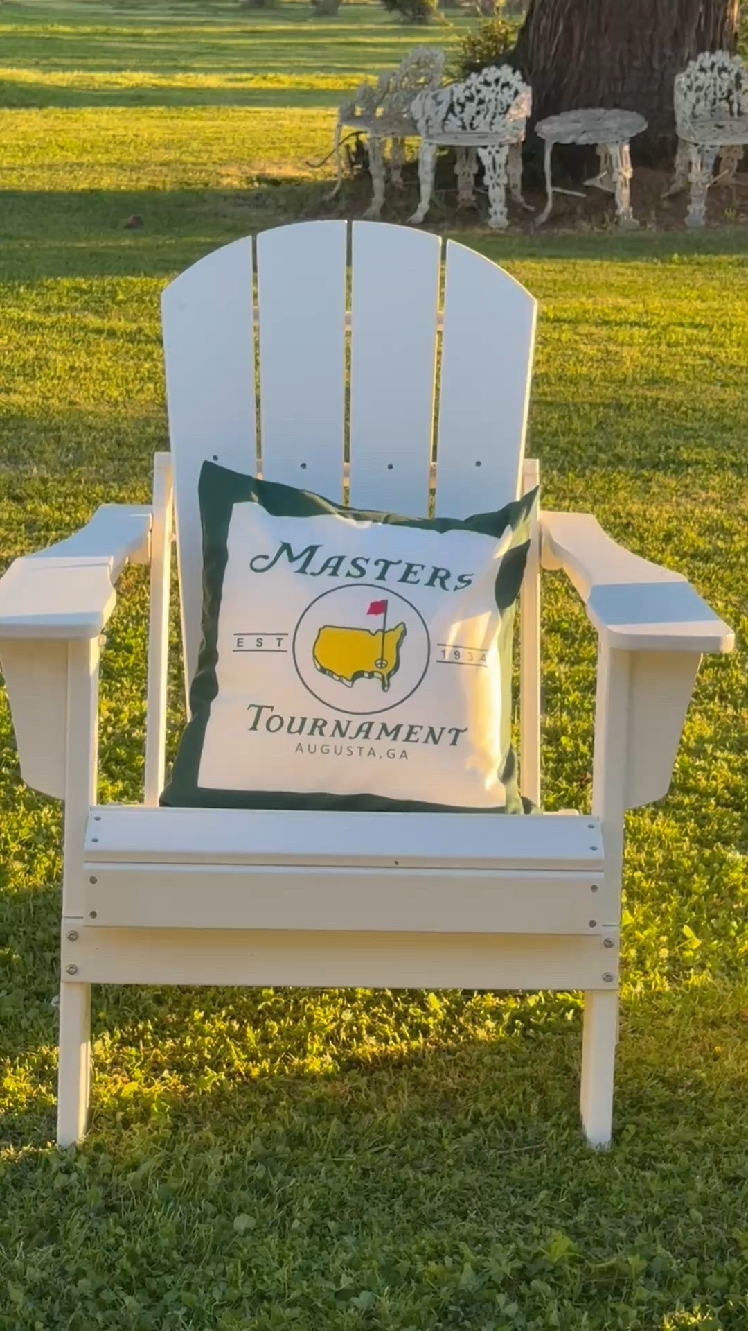 Masters golf tournament throw pillows on white Adirondack chairs and a classic white table. 💚

#LTKHome #LTKSeasonal #LTKWatchNow