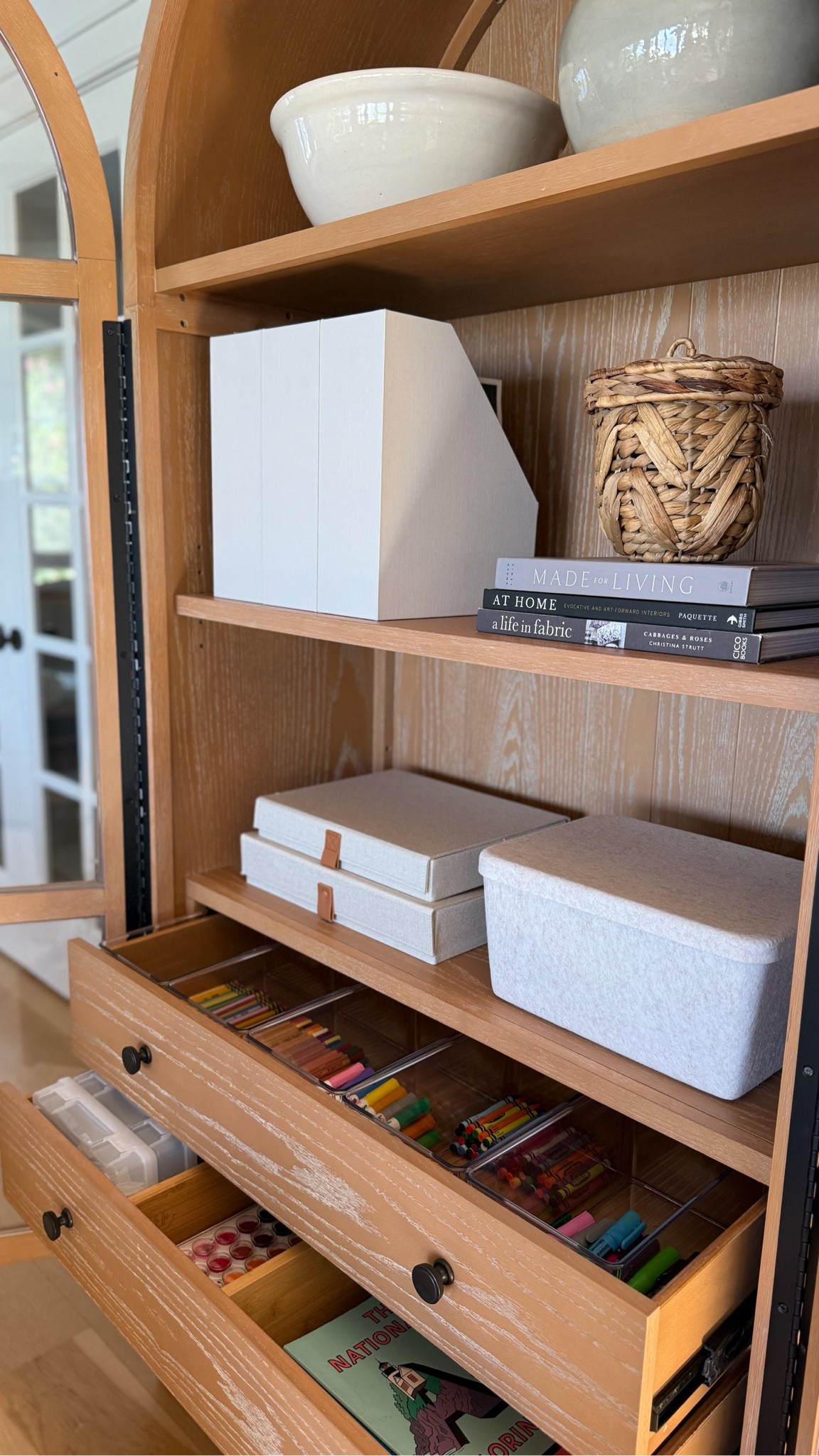You don’t need a craft closet to be organized! This arched cabinet blends seamlessly with your furniture - and it doesn’t need to look like it’s styled for craft time. Inside there’s everything kids need for creative time!

#LTKFamily #LTKHome