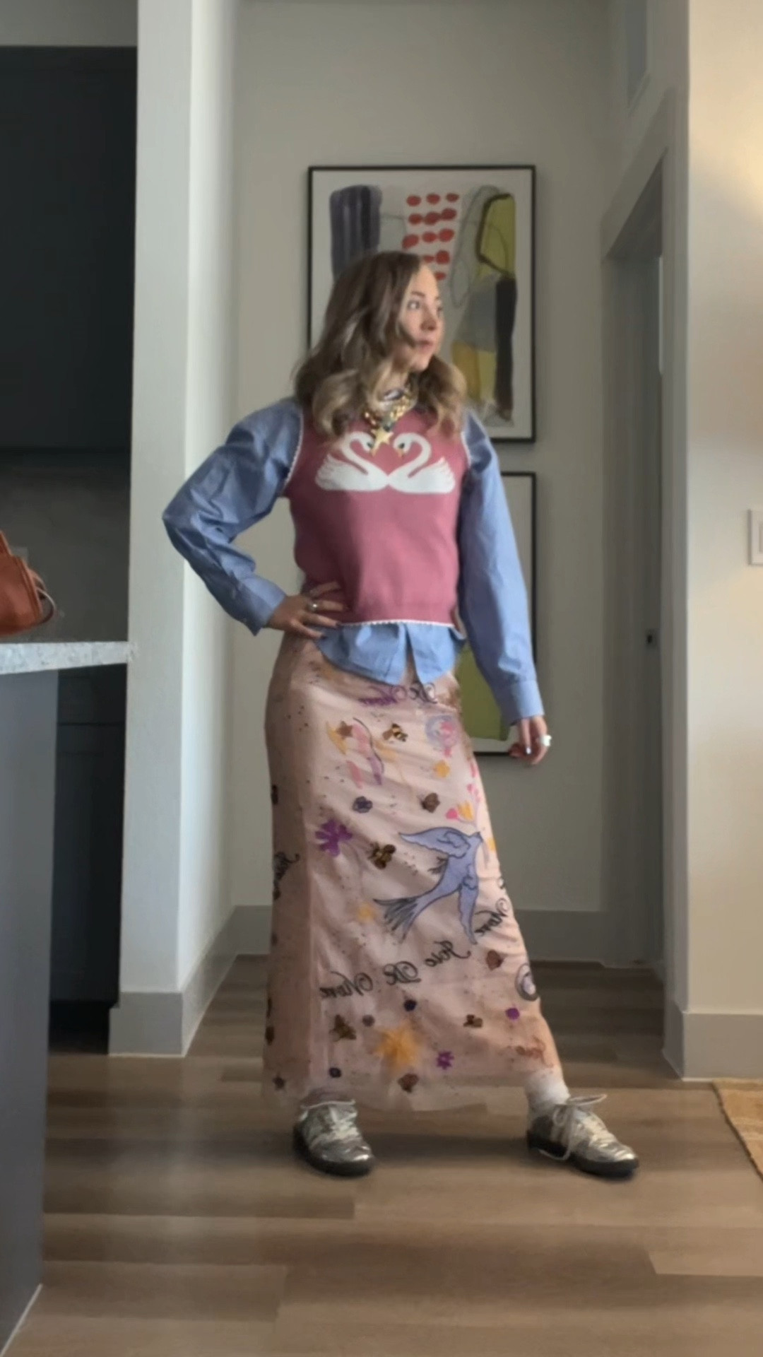 Workwear OOTD!!! Pink swan sweater vest, blue and white pinstripe button down, Anthropologie graphic skirt, and wales Bonner silver adidas shoes!!!

#LTKootd #LTKHoliday #LTKWorkwear