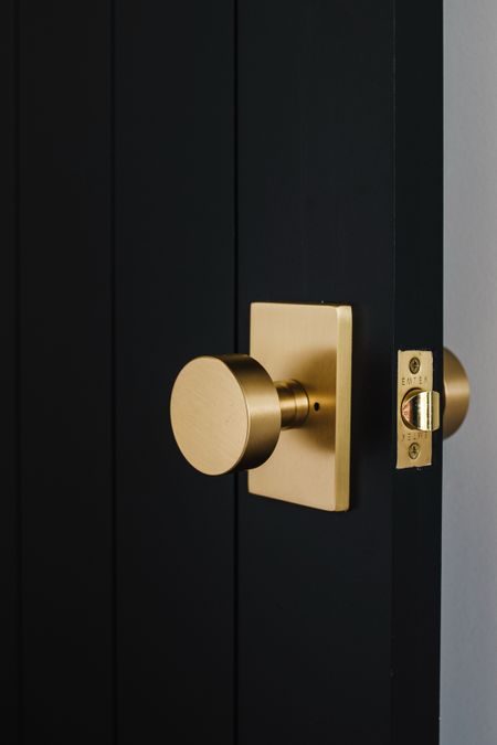 We love our black doors with vertical lines, but it’s the hardware that shines!

#LTKhome