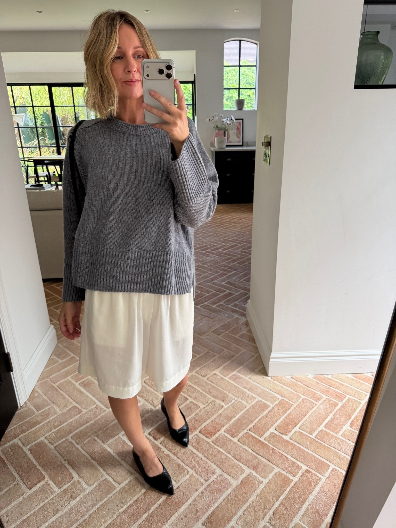 Loving these long shorts 🤍

grey knit sweater, oversized crewneck jumper, ribbed hem sweater, cream midi skirt, gathered skirt, pull on skirt, black pointed toe flats, black leather flats, black shoulder bag, casual chic outfit, off duty style, autumn transitional dressing, elevated basics, quiet luxury, neutral color palette, monochrome styling, mirror selfie ootd, ltkstyletip, ltkseasonal, ltkfindsunder100, ltkworkwear, ltkitbag

#LTKautumn #LTKdatenight #LTKpartywear