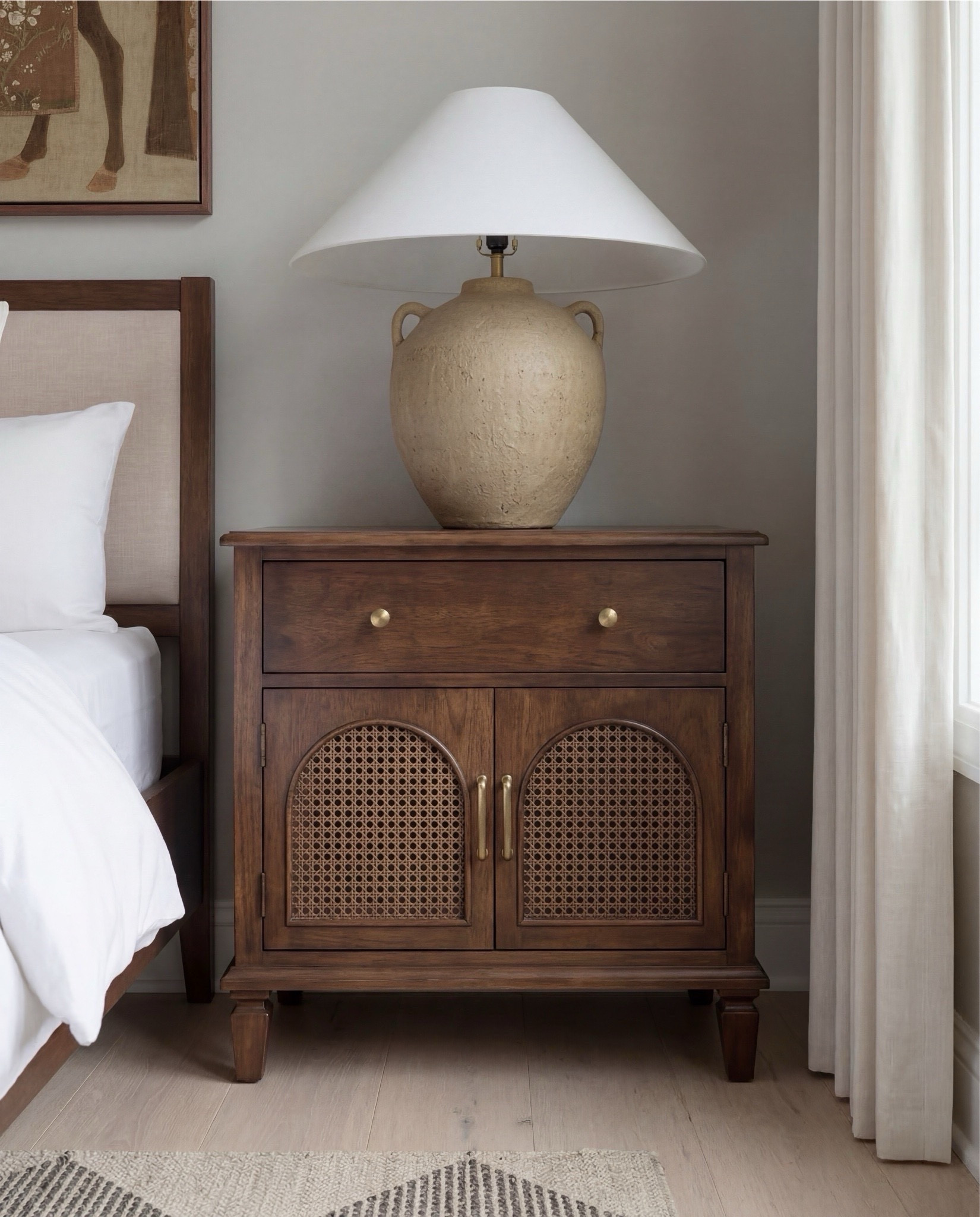 Shop The Look
Wood upholstered bed
Brass metal upholstered bench
Black and white checkered rug
Dark and cane wood nightstands 
Oval brass decor tray
Round beige brown ceramic table lamp
Vintage brown and beige animal wall art
White curtains 



#LTKSaleAlert #LTKHome