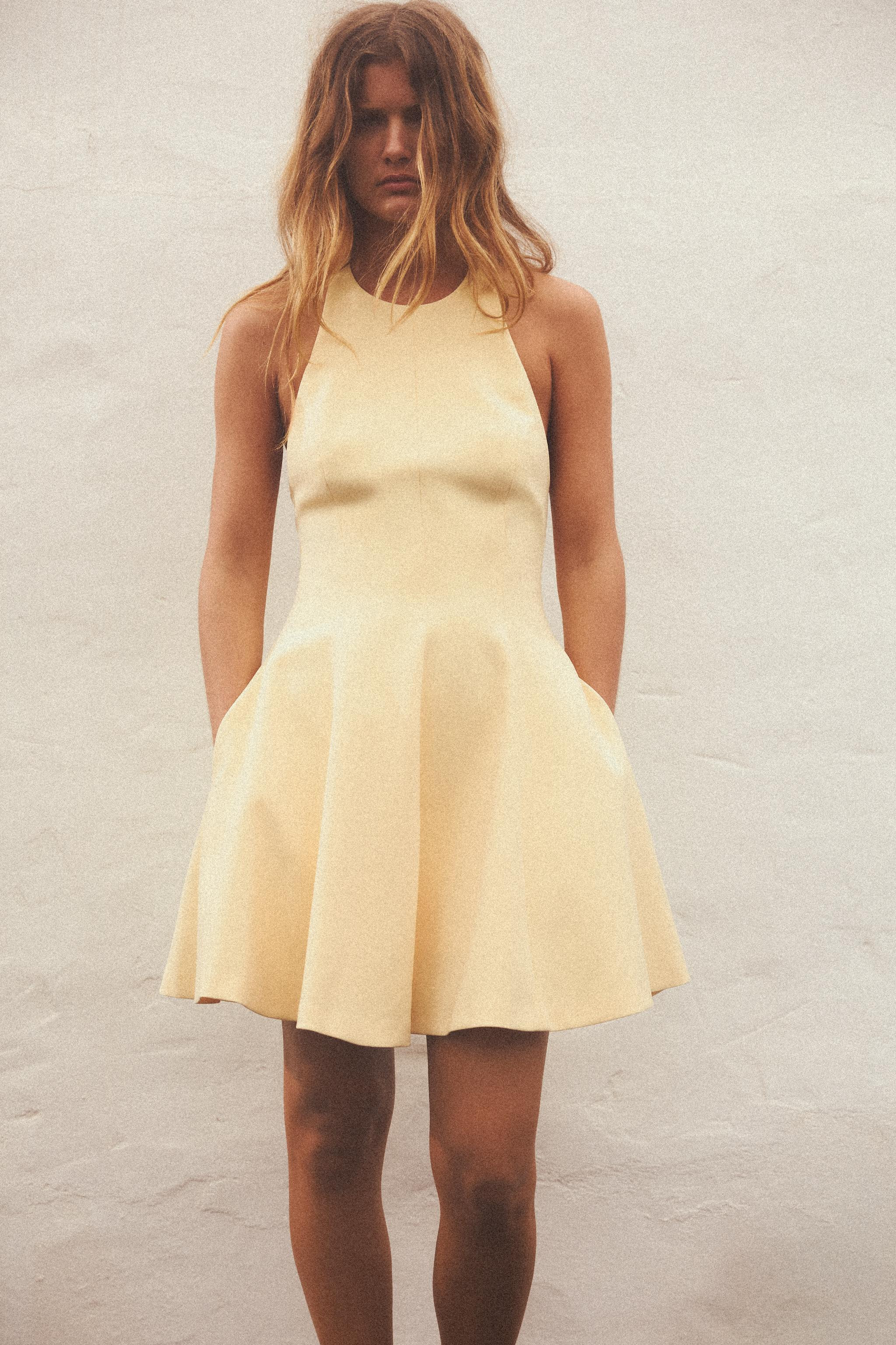 Short halter neck dress. Open back. Hidden in-seam side pockets. Matching inner lining. Back clos... | Zara US