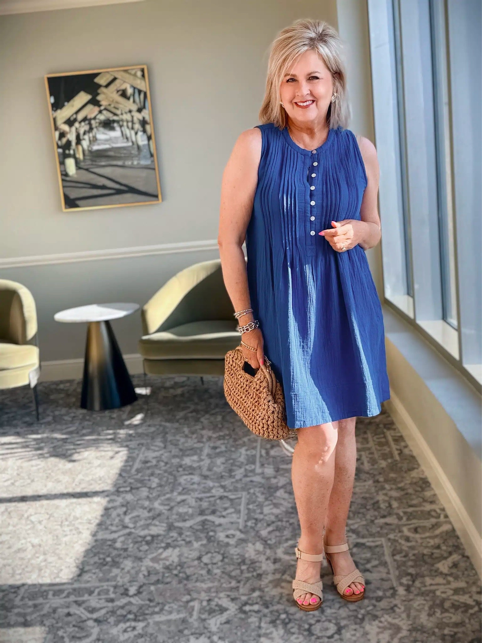 This dress is a great option for everyday wear and it’s available in several colors. I’m wearing a size medium and have paired it with a fun raffia clutch and Summer sandals.

#LTKOver40 #LTKSeasonal #LTKootd