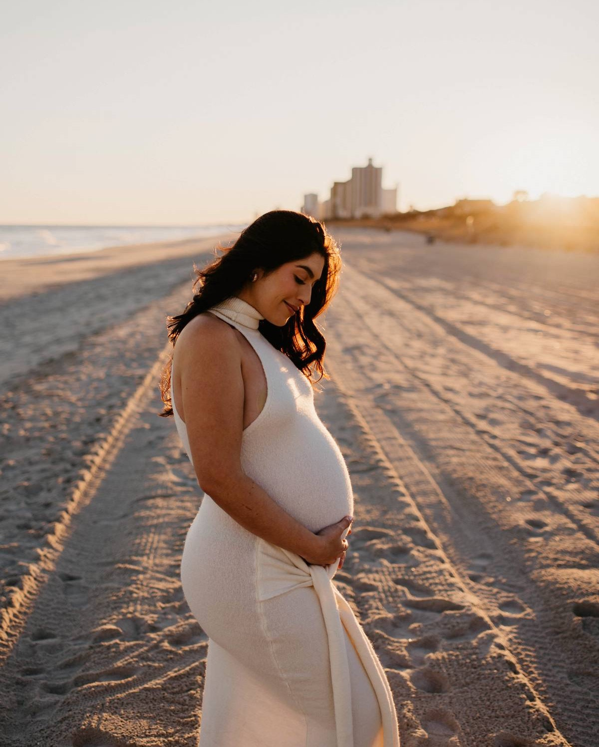 maternity photos 🐚🪽 this dress isn’t maternity but it’s super stretchy and I knew it would work perfectly at the beach. I sized up one size to an L

#LTKBump #LTKFindsUnder50