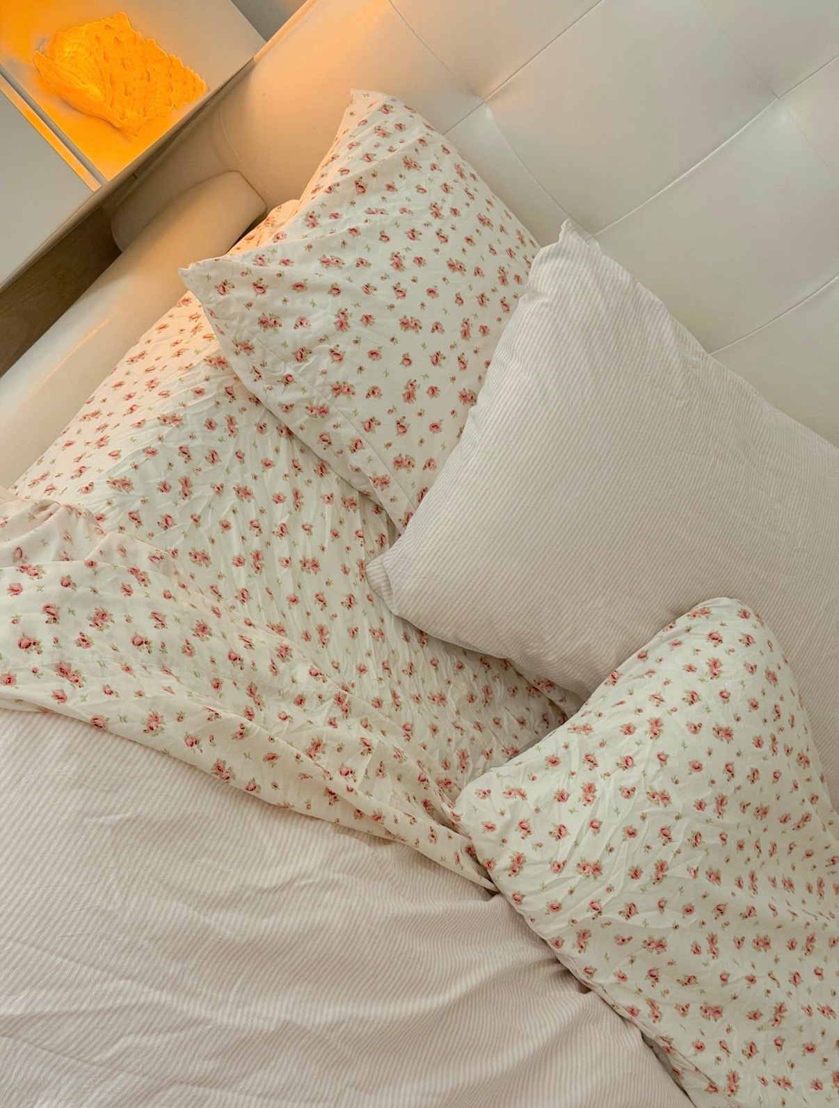 Pink striped duvet cover 
Pink floral sheet set 
Pinterest bedding 
Shell night light 
Seashell nightlight 

#LTKmorningroutine #LTKGiftGuide #LTKHome