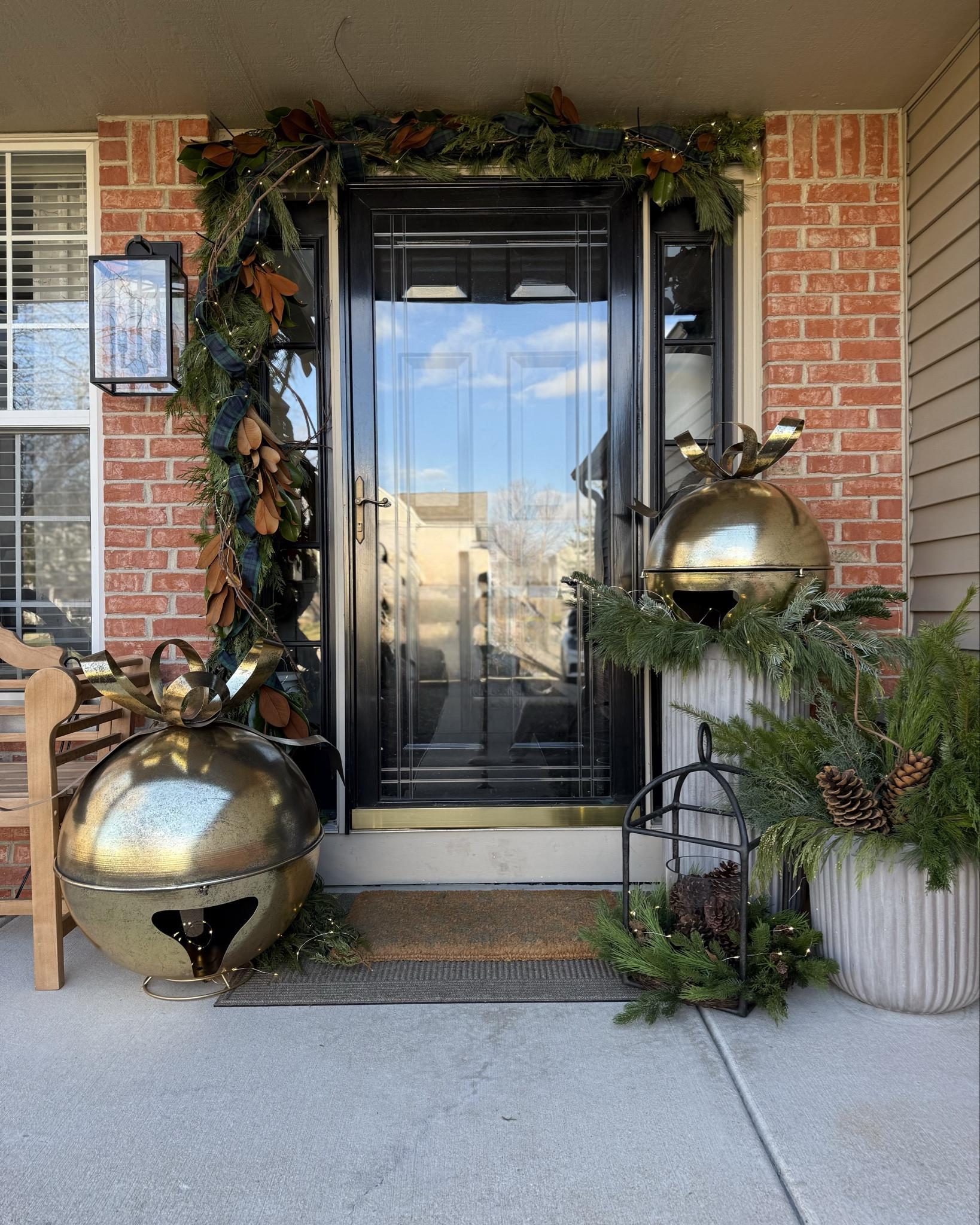 Christmas front porch 2025. I opted for fresh garland around my doorway and fresh stems in my planters but linked some similar faux options. 

#LTKSaleAlert #LTKHome #LTKHoliday