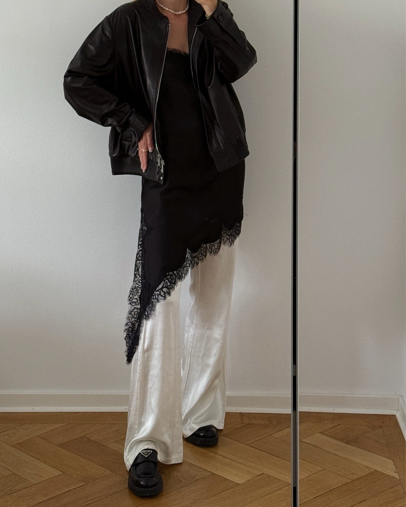 autumn outfit • wearing a long white silk pants combined with a black asymmetrical lace top and a leather jacket #lacetop #lace #autumn #autumnoutfit

#LTKdeutschland #LTKstyletip #LTKeurope