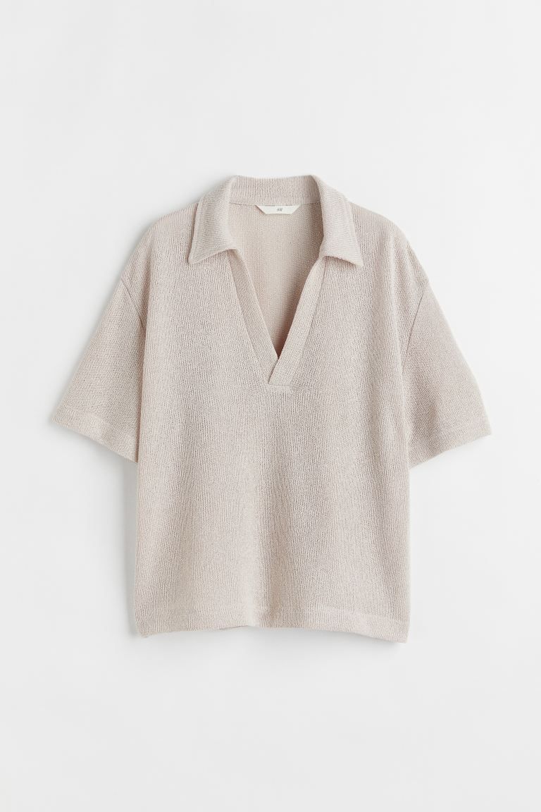 Top in a soft, fine-knit viscose blend with a collar, a V-shaped opening at the front, gently dro... | H&M (US + CA)