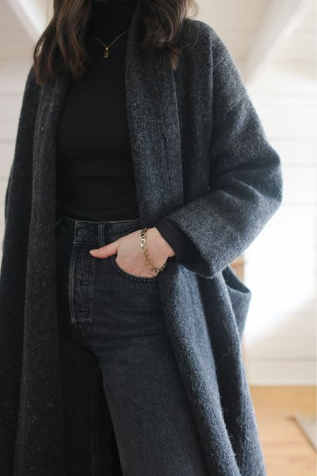 By now you know I love a monochrome look and this is no exception. Deep black and heathered charcoal are a fail safe combination. A few glimmers of gold or silver jewelry always add just enough polish to make it feel complete. 

Sweater coat is by Elizabeth Suzann Studio - Currently sold out. 

#springoutfit #cheekyjeans 

#LTKSeasonal