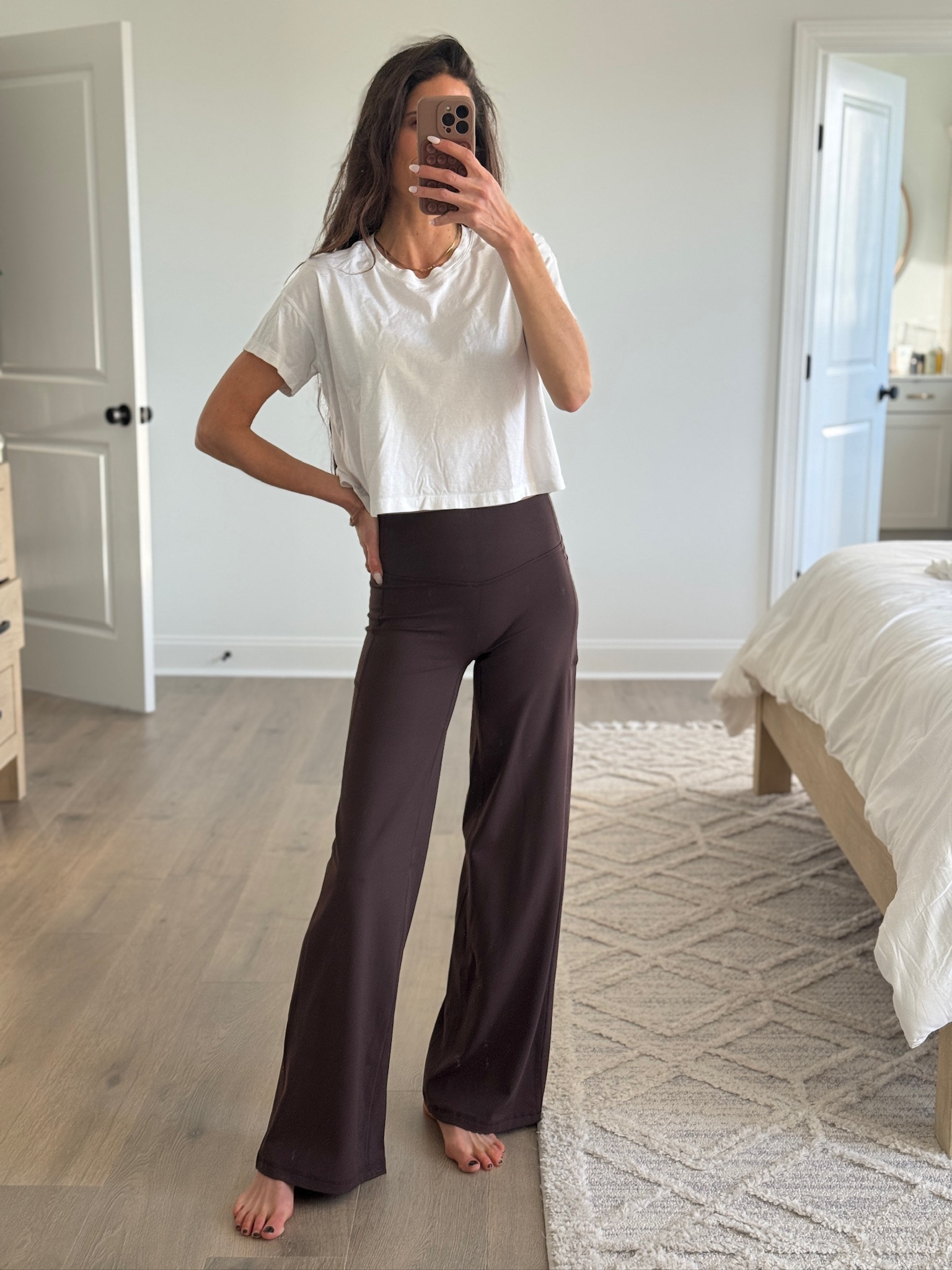 White cropped tee styled with high-waisted wide leg pants for a relaxed, everyday outfit. Comfortable, flattering fit that works for lounging at home, casual errands, travel days, or dressing up with sneakers or slides. Easy neutral outfit with a soft, effortless feel. White cropped t-shirt, wide leg pants, casual lounge outfit, athleisure style, everyday mom outfit, comfortable casual wear, relaxed fit pants, neutral outfit ideas.

#LTKmomlife #LTKFindsUnder50 #LTKootd