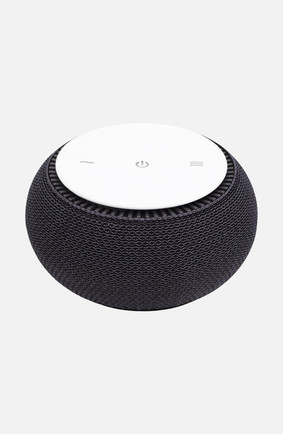 SNOOZ original white noise machine in charcoal gray, a small round sleep device