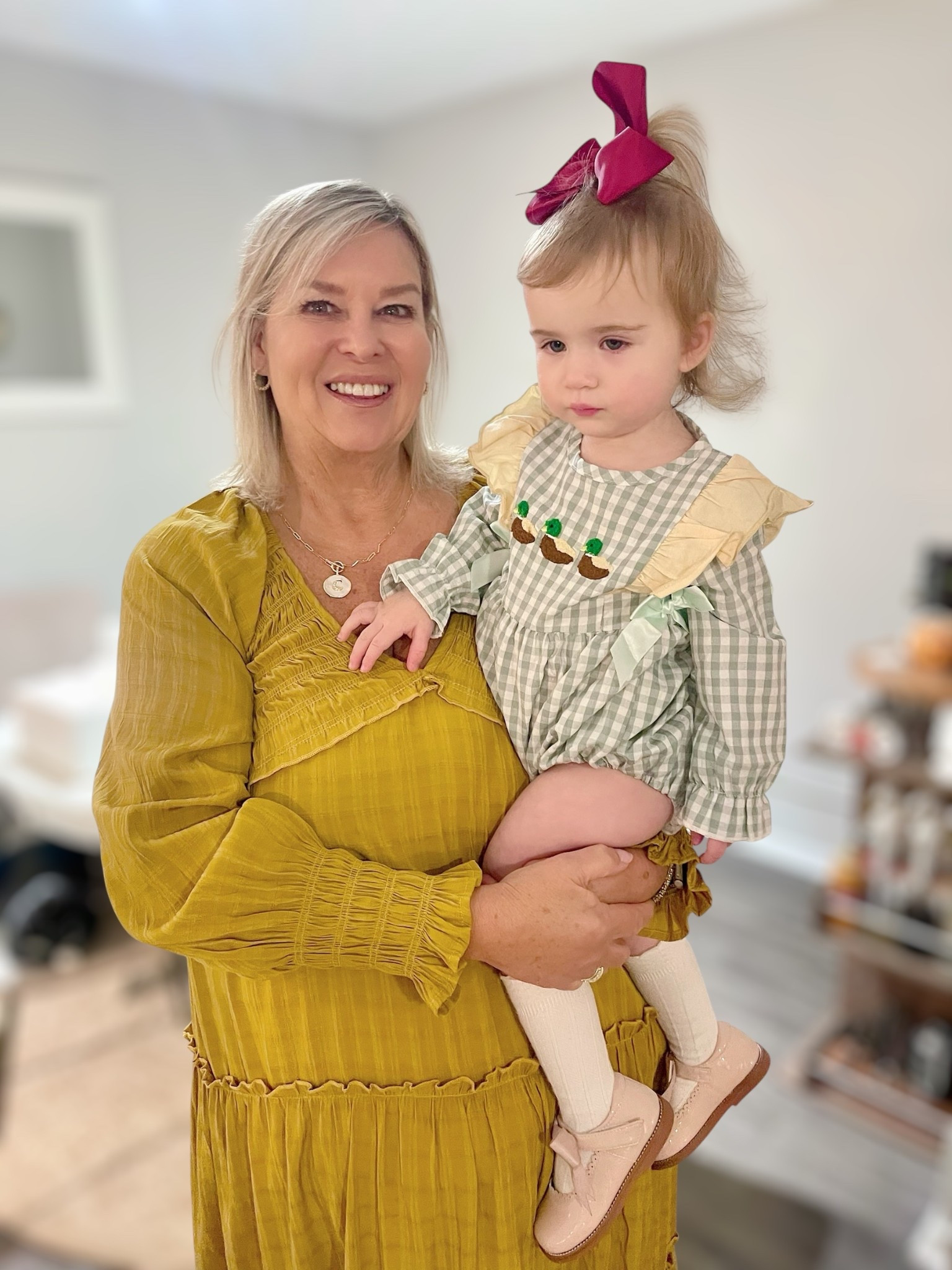 Three generations of style ✨ My mom and Caroline in the cutest fall outfit combo 💛 This R.Vivimos maxi dress is the perfect mustard yellow fall dress, and Caroline is picture-perfect in her green gingham baby romper with mallard duck embroidery 🦆. We paired it with classic white knee-high socks, blush pink Mary Jane shoes, and a big bow 🎀 for a timeless toddler girl outfit. I also linked my mom’s Melinda Maria initial heart necklace for the perfect everyday jewelry layering piece 💕.

📌 Shop these looks for family photos, fall outfits, or Mommy & Me matching style!

⸻


	•	fall family photo outfits
	•	toddler girl gingham romper
	•	duck embroidered baby outfit
	•	mustard yellow maxi dress Amazon
	•	mommy & me fall style
	•	toddler girl Mary Jane shoes
	•	baby girl hair bows Amazon
	•	everyday jewelry layering necklace


#LTKFindsUnder50 #LTKBaby #LTKKids