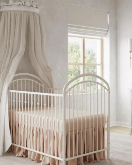 Everyone loves this look and while this crib is sold out, I have linked one that I love even better! It reminds me of a Restoration Hardware crib look alike. 
Details:
1. Little Seeds Piper Upholstered Metal Crib, Gold

2. BEST SELLER
Pottery Barn Monique Lhuillier Metallic Cornice Canopy, Girl Room, Baby Room, Nursery
CLEARANCE SALE
$249.99

3. LoveShackFancy x Pottery Barn Cabbage Rose Bow Organic Crib Fitted Sheet

4. LoveShackFancy Swaddle Set
Featuring dreamy floral motifs, these supersoft swaddling blankets are equal parts charming and practical.

5. LoveShackFancy Sweet Dreams Ruffled Bow Baby Quilt
Pink or white

6. LoveShackFancy Bow Chandelier

7. Flat Wallpaper - Classic Baroque Wall with Moldings and Columns. 
Self-adhesive Removable Mural, Decal or Tapestry, Backdrop, Custom size

8. LOW IN STOCK, ONLY 1 LEFT
Price: $315.00
Baby Girl Ruffle Crib Bed Set, White Ruffled Crib Skirt, Pink Crib Bows, Girl Nursery Bedding

9. Swan Watercolor Print 
ONLY 8 LEFT AND IN 10 CARTS
Price: $44.78+
Original Price:$55.98+
20% off sale for a limited time, Minimalist Blush Pink Feather Pink Bird, Swan Painting, Nature Wall Decor

10. ONLY 2 LEFT AND IN 3 CARTS
Price: $39.50
swan toy , soft swan toy , childrens swan toy , christening toy , birthday swan toy , baby shower gift , stork, flamingo

11. GREENGUARD GOLD CERTIFIED
BEST SELLER
Paxton Manual & Power Swivel Glider Recliner

12. Upholstered Swivel Glider- Pink Dusty Rose

13. GREENGUARD GOLD CERTIFIED
FAIR TRADE
Merced Glider & Ottoman

14. Baby Cantara Floral Pinafore

15. LoveShackFancy Textured Hearts Baby Blanket

16. ONLY 1 LEFT AND IN 20+ CARTS
Price: $80.28
Swan Baby Nursery Mobile- Baby girl mobile- Swan nursery decor- Crib mobile- Baby girl nursery mobile




#LTKMostLoved #LTKbaby #LTKGiftGuide #LTKbump