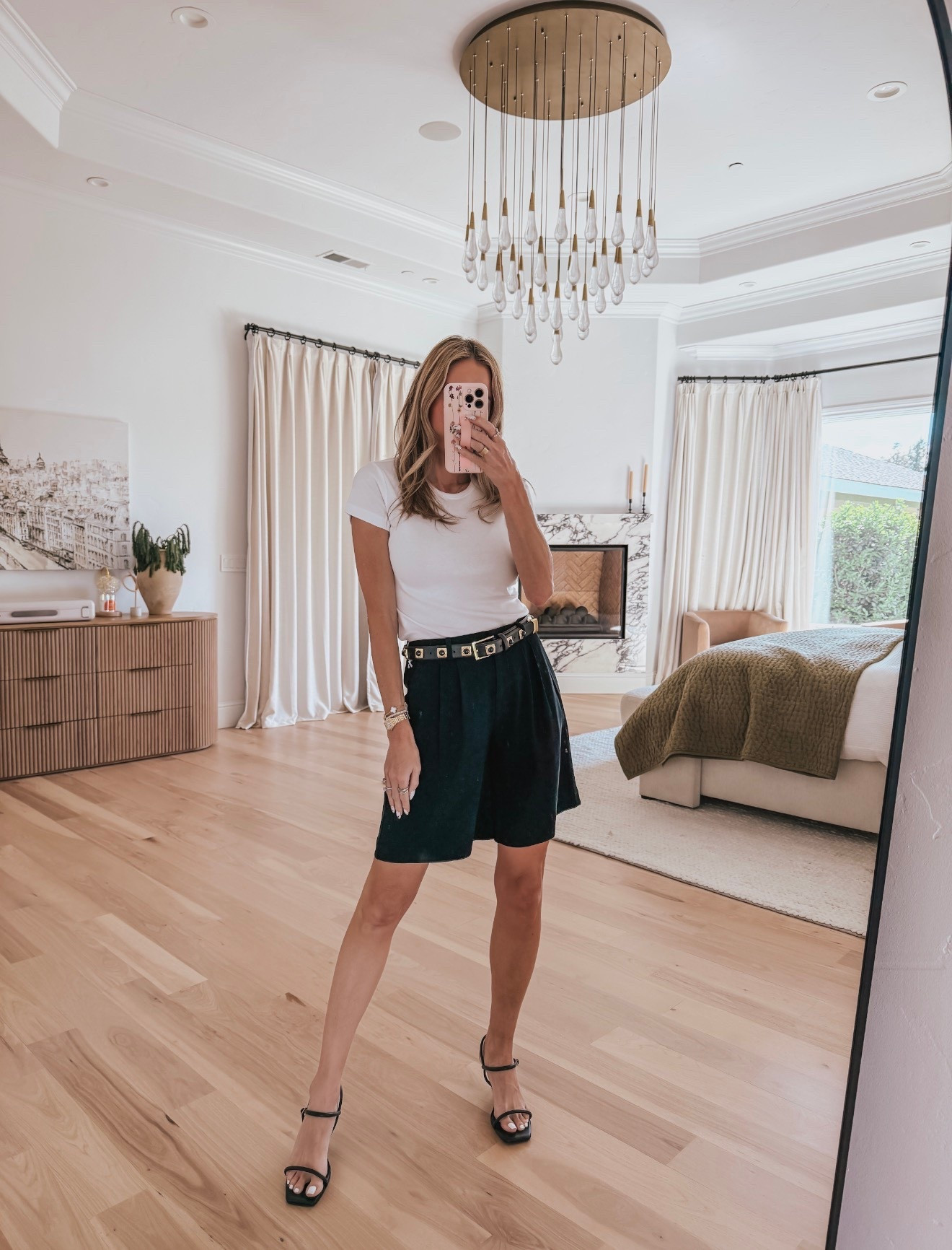 Basic done right: a crisp white tee with Bermuda shorts, paired with a fun flip-flop heel, an east-west bag, shield sunglasses, and gold statement earrings. Clean, polished, and the kind of outfit that looks effortless every time.

#LTKTravel #LTKootd #LTKmomlife