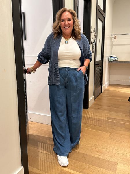 These chambray trousers are 10/10. I’m wearing a 14. They are appropriately loose. 
The sweater is a size large. 
The tee is. Well, fitted. Wearing a large  

#LTKfindsunder50 #LTKSpringSale #LTKmidsize