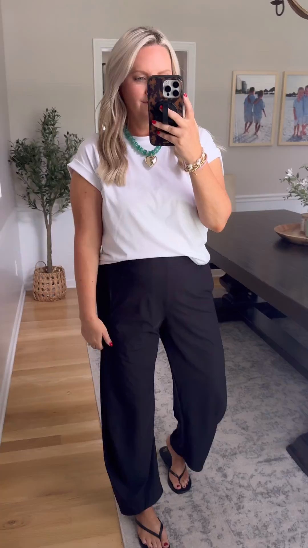 TRENDING! These black wide leg pants are one of those closet staples you can style a hundred different ways. Paired with a simple white tee and sandals, this look feels effortless, elevated, and perfect for work, travel days, dinner, or everyday wear.

black wide leg pants, casual chic outfit, everyday style, workwear outfit, elevated basics, neutral fashion, effortless summer outfit, travel outfit, comfortable fashion, lovelylifestyling

#LTKootd #LTKTravel #LTKmomlife