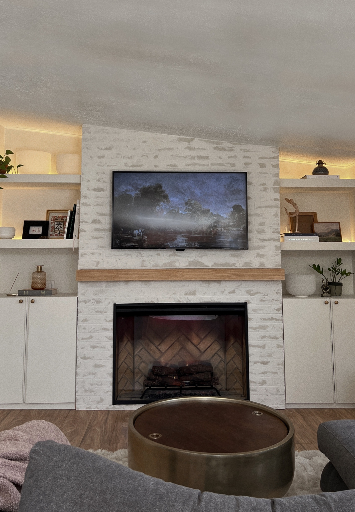 Cozy fireplace. Frame tv. Amazon home finds. Fireplace styling. Coffee table book. Mantle styling. Thrifting. Vintage. Antique. Decor. Home decor. Modern farmhouse. Modern traditional. Transitional style. Fireplace makeover. LED light strip. Faux brick. Affordable type. Amazon find. Hidden gem on Amazon. Tv mount. IKEA Ivar cabinet hack.#LTKFind

#LTKhome #LTKstyletip