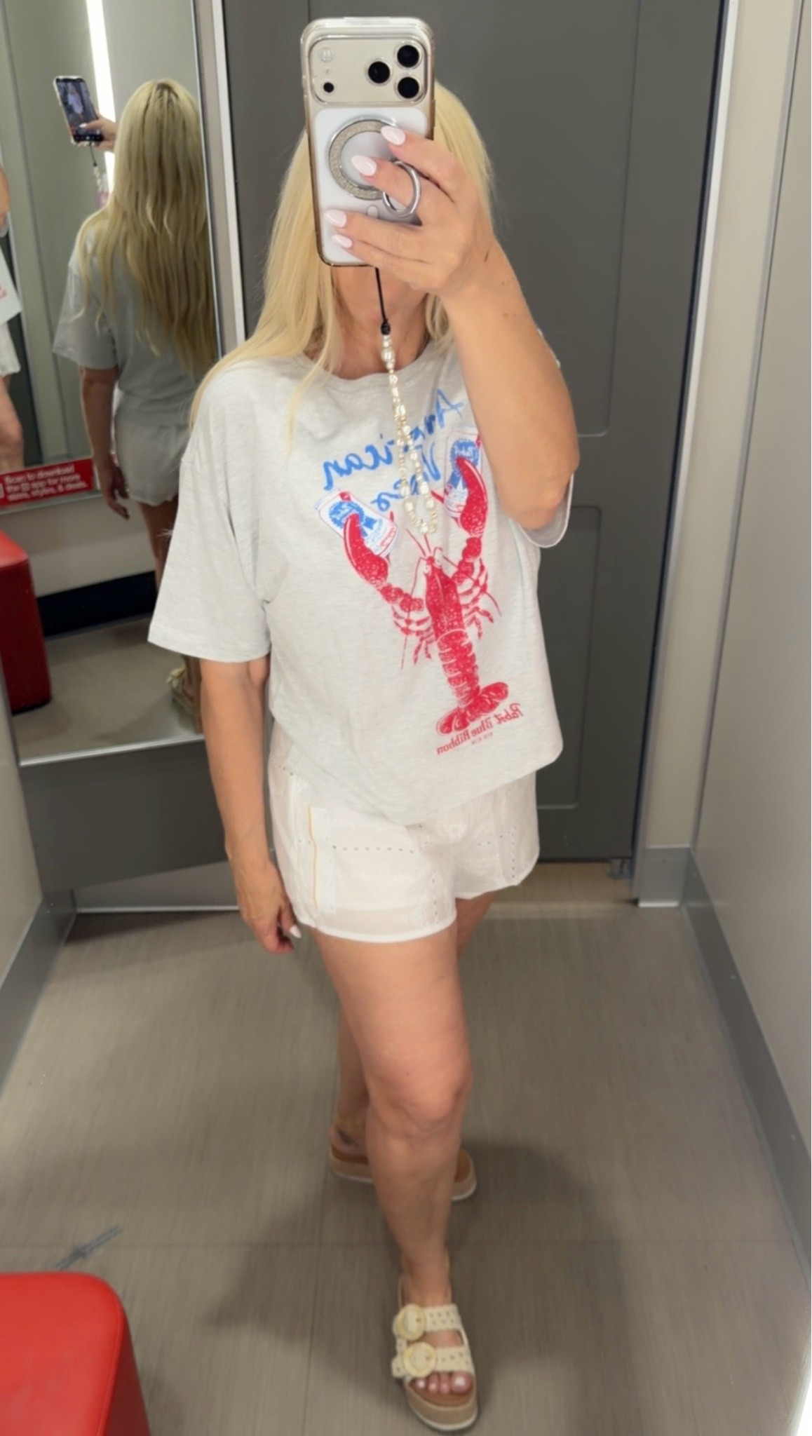 Relaxed coastal summer outfit featuring white eyelet shorts and a graphic tee. Cute casual vacation outfit for beach towns and summer weekends

#LTKSeasonal #LTKootd #LTKPetite