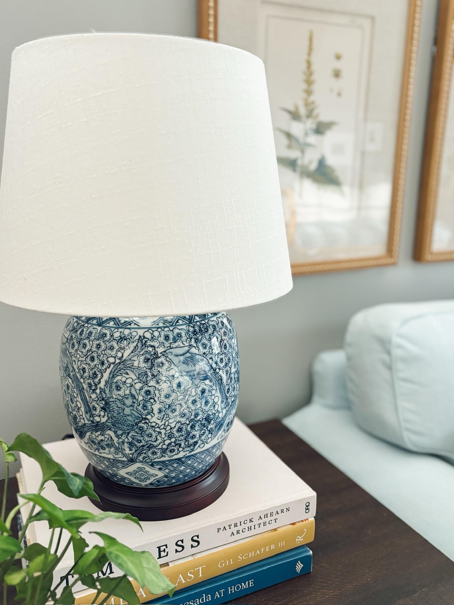 Blue and white chinoiserie lamp with wood base, botanical framed artwork, end table 

#LTKSeasonal #LTKSaleAlert #LTKHome