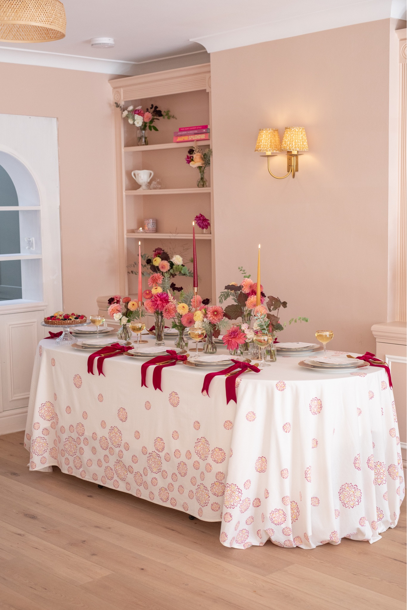 An autumn tablescape with berry red, coral orange and amber yellow colours, perfect for an elegant Thanksgiving or Halloween dinner party (just add pumpkins!). The tablecloth is available on my website and designed by me with a dahlia flower design 🤍

#LTKhome #LTKeurope