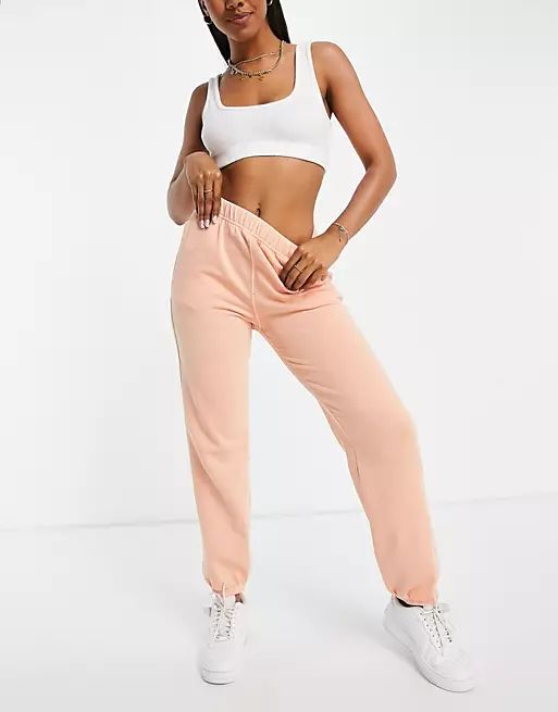 Champion fleece sweatpants in peach | ASOS (Global)