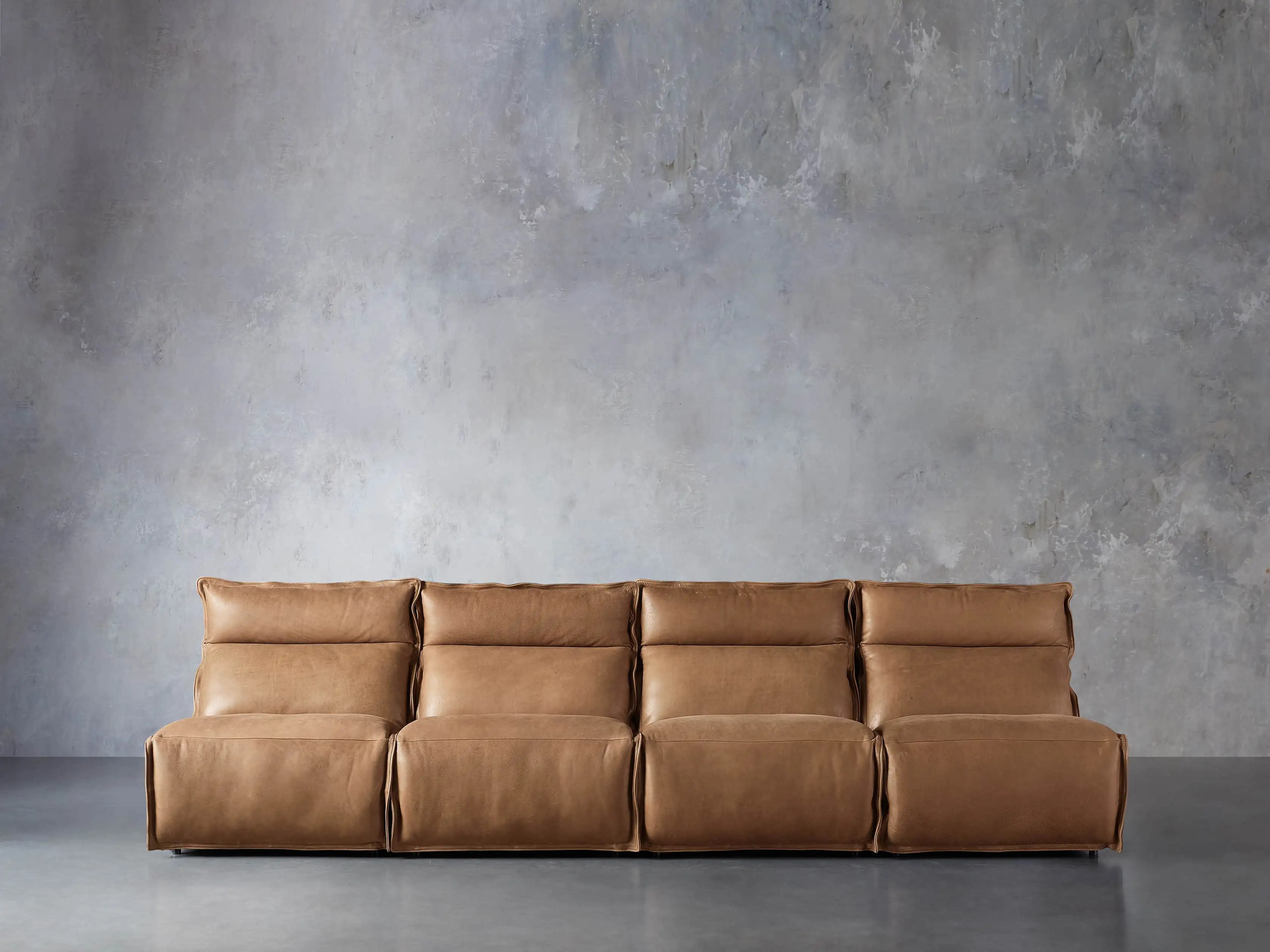 Rowland Leather Four Piece Armless Motion Modular Sofa | Arhaus