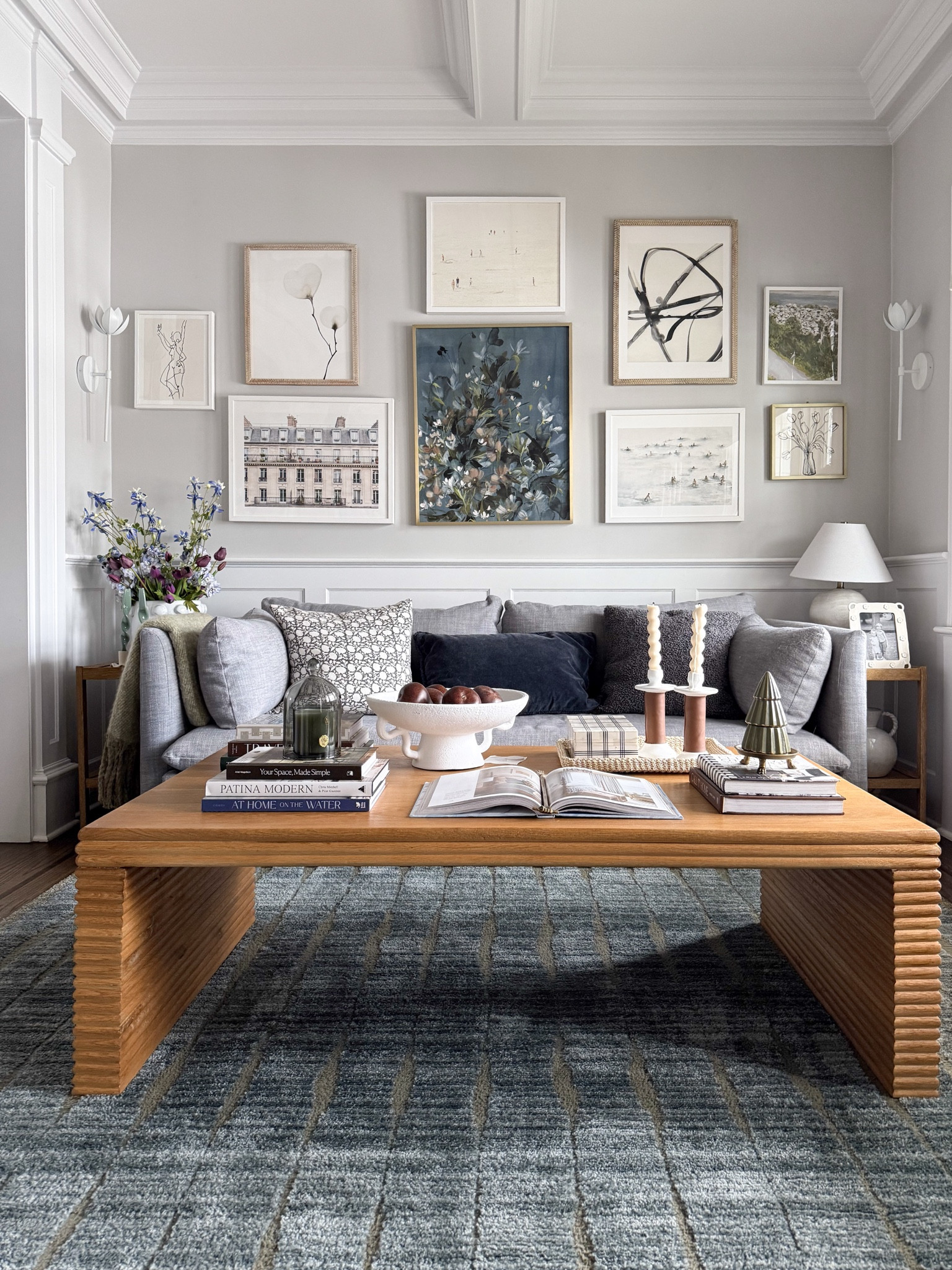 The den is one of our favorite spaces to relax, with cozy seating and layered textures throughout the room. The blue sofa adds a beautiful coastal inspired pop of color while still keeping the overall palette calm and neutral. Paired with soft rugs and warm wood tones, the space feels inviting and comfortable.

den living room decor, blue sofa living room, coastal neutral decor, cozy family room design, neutral living room styling, modern traditional living room, layered home textures, comfortable seating area, family room inspiration, timeless home interiors, living room styling ideas, girlonthehudson

#LTKHome