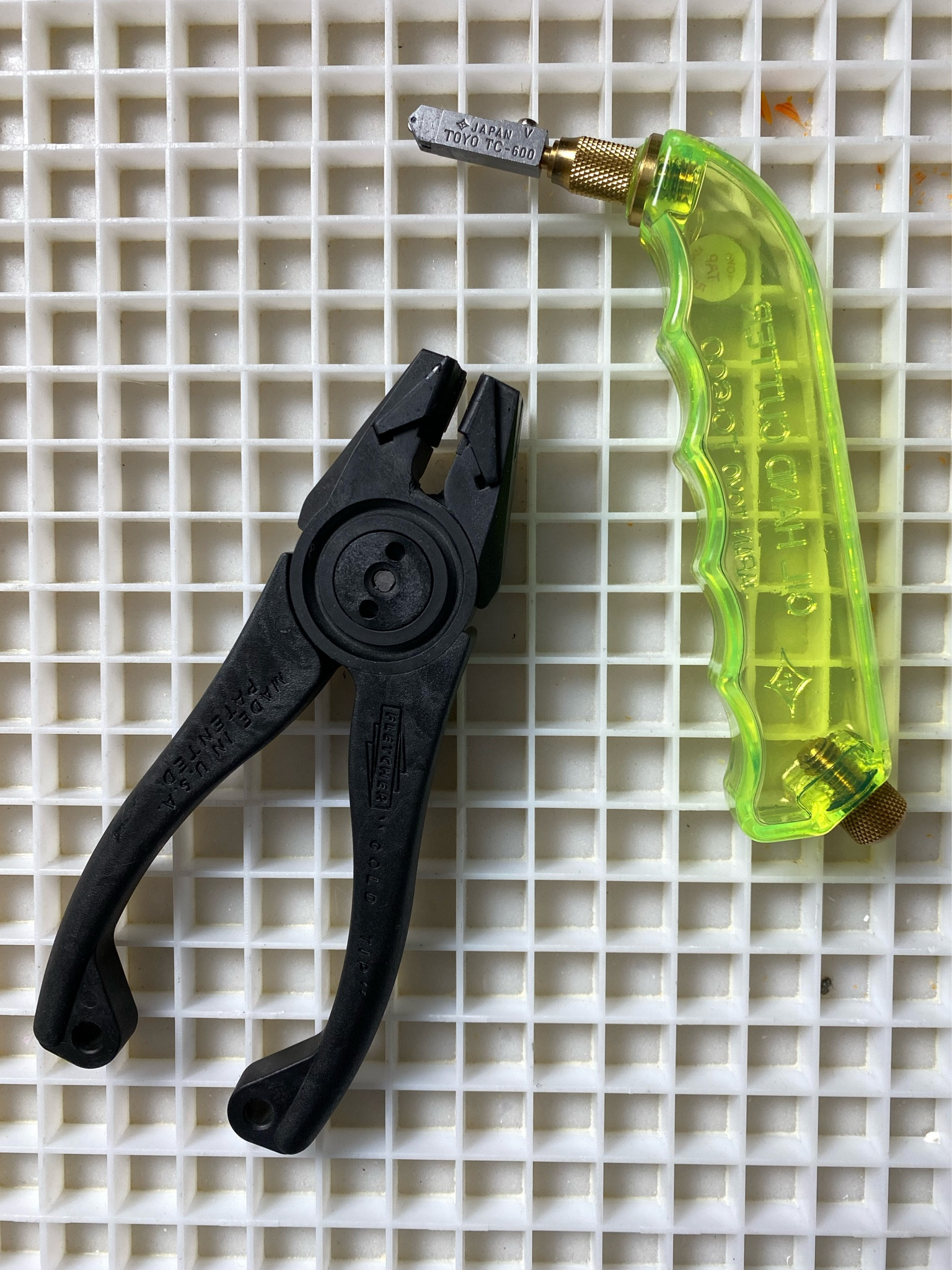 Sharing my fave tools when scoring and cutting glass for mosaic art. ✨ The waffle grid provides a great scoring surface for glass. ✨ Another positive about the waffle grid is that you can break your stained glass over it allowing all of the shards and splinters to be caught. ✨ The grid keeps everything off your actual work table, and makes for easier clean-up! For mosaic tips, tutorials, inspiration, and so much more please visit my YouTube channel: YouTube.com/julieweilbacher. Follow @julieweilbacher on Instagram for all things mosaic art. stained glass - mosaics - glass art - craft room - glass crafts - glass mosaic - crafts night in - craft tools - diy art