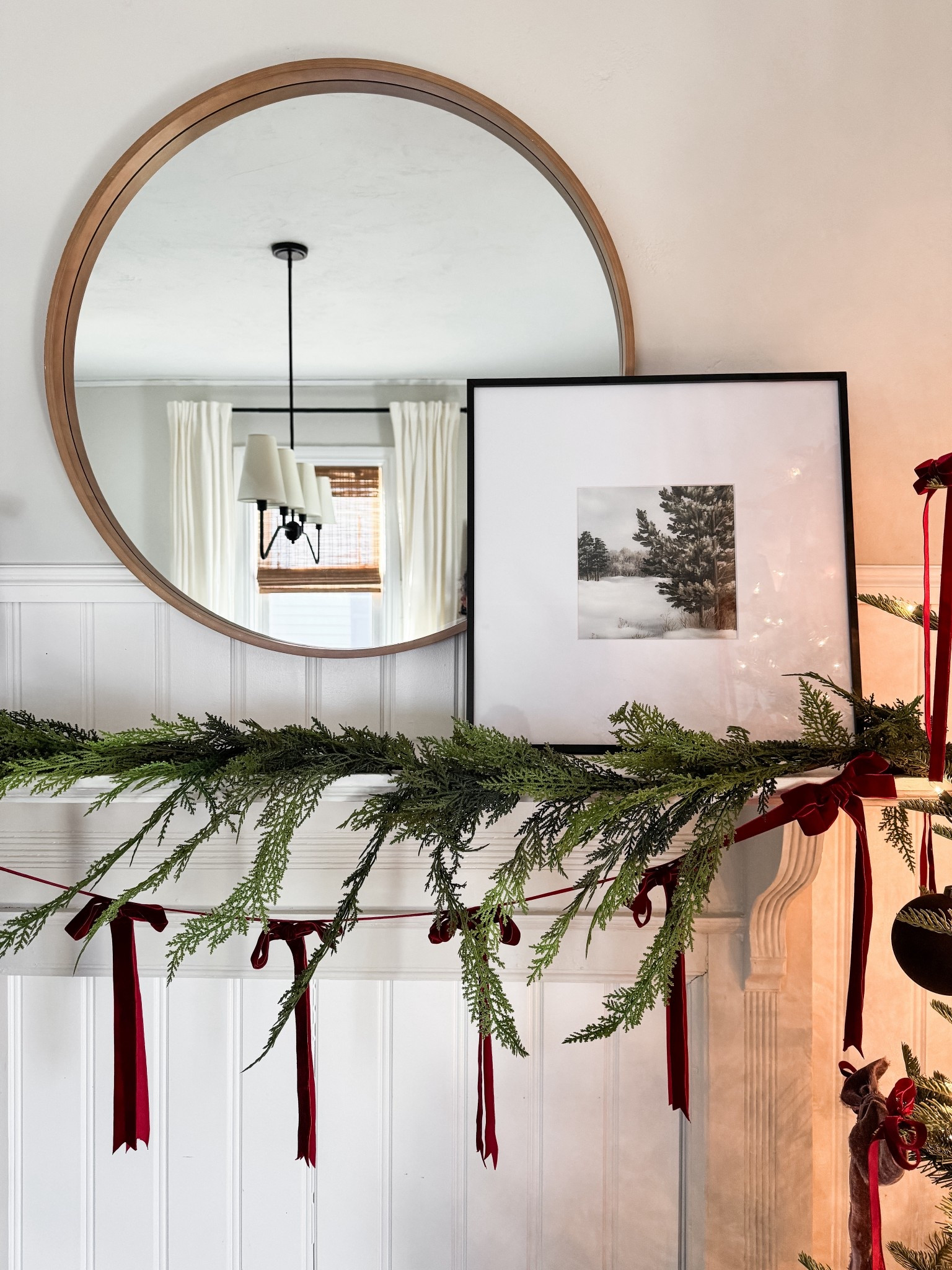 Christmas Mantle decor. Winter art, Norfolk pine garland, bow garland, red velvet bows. 

#LTKHoliday #LTKSeasonal #LTKHome
