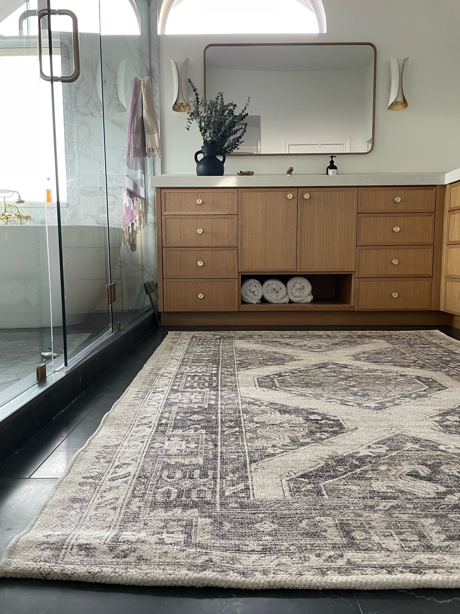 White oak cabinets with brass knobs, modern sconces and lots of accessories. Washable bathroom rug, perfect for hard surfaces. Decor, furniture, bathroom, rugs, Turkish towel, hand towel, Mediterranean towel. Washable run from athome 

#LTKhome #LTKunder100 #LTKFind