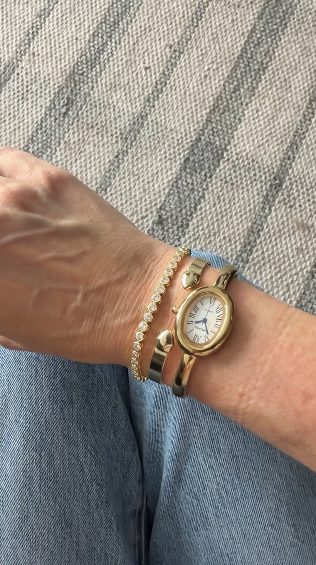 My black watch isn't identical because it sold out so I linked one similar and the black necklace with the gold is so awesome. I just bought it and I wear it with simple white tees. 