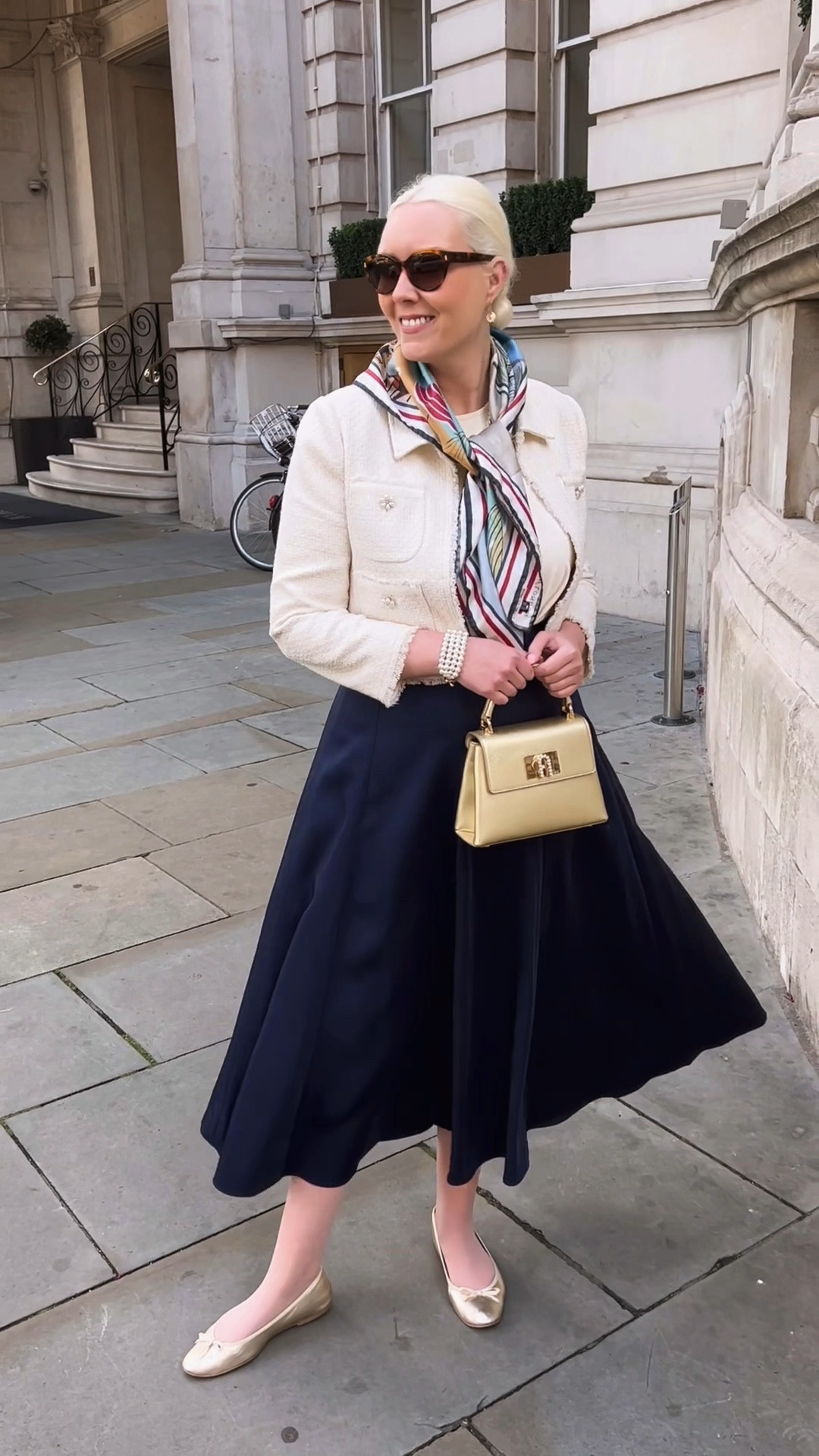 Navy is the perfect colour to transition into autumn. This is the fab Hobbs London ‘Charteris’ skirt from their Limited Edition collection (now on sale!) and it moves beautifully! I teamed with the Hobbs London ‘Monica’ Pearl Bracelet and Necklace and their Lisa Gold Ballerinas. The Ada ivory tweed cropped jacket with pearl button detailing is by LK Bennett and is also on sale. I finished the look with Dower & Hall London’s hammered gold disc & freshwater Pearl nomad earrings, the Poolside silk scarf by Aspinal of London and the Furla Gold 1927 top handle bag from AW23 

#LTKsale #LTKuk #LTKeurope