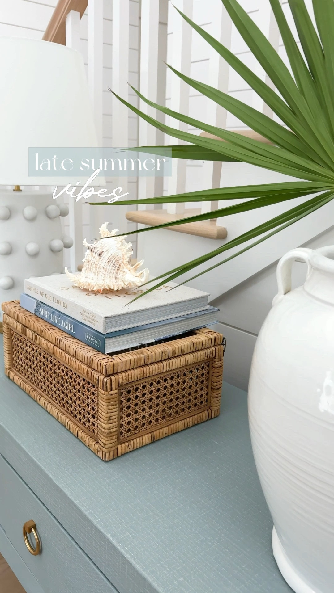 Our coastal summer entryway including a blue linen console table, circle dot lamp, rattan storage box, coastal coffee table books, a seashell and a fan palm in an oversized white ceramic vase. This is a fresh cut fan palm but I’m also linking a faux version I like.
.
#ltkhome #ltkseasonal #ltkfindsunder50 #ltkfindsunder100 #ltksalealert console table styling, entryway decor, foyer tables, Serena & Lily vibes

#LTKHome #LTKSaleAlert #LTKSeasonal