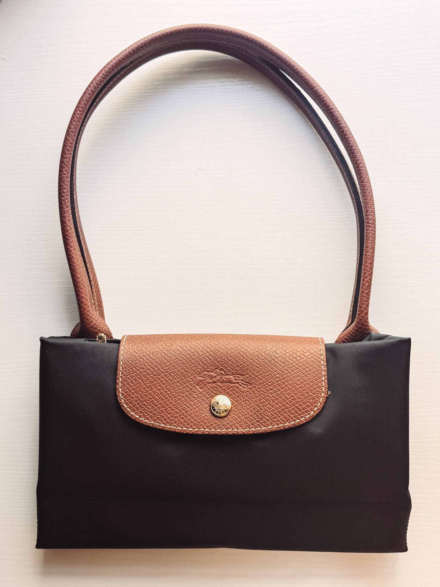 Diaper Bag Option #2: Longchamp Large Le Pliage Tote ✨ this has primarily been used for travel but I think will make a great diaper & mom bag for the same reasons I loved it for travel: it’s durability, the space & how care free you can be with this bag on the go! And with a shoulder strap & organizer that I found on Amazon, I think it will be a good for both everyday and travel  

#LTKTravel #LTKmomlife #LTKBaby