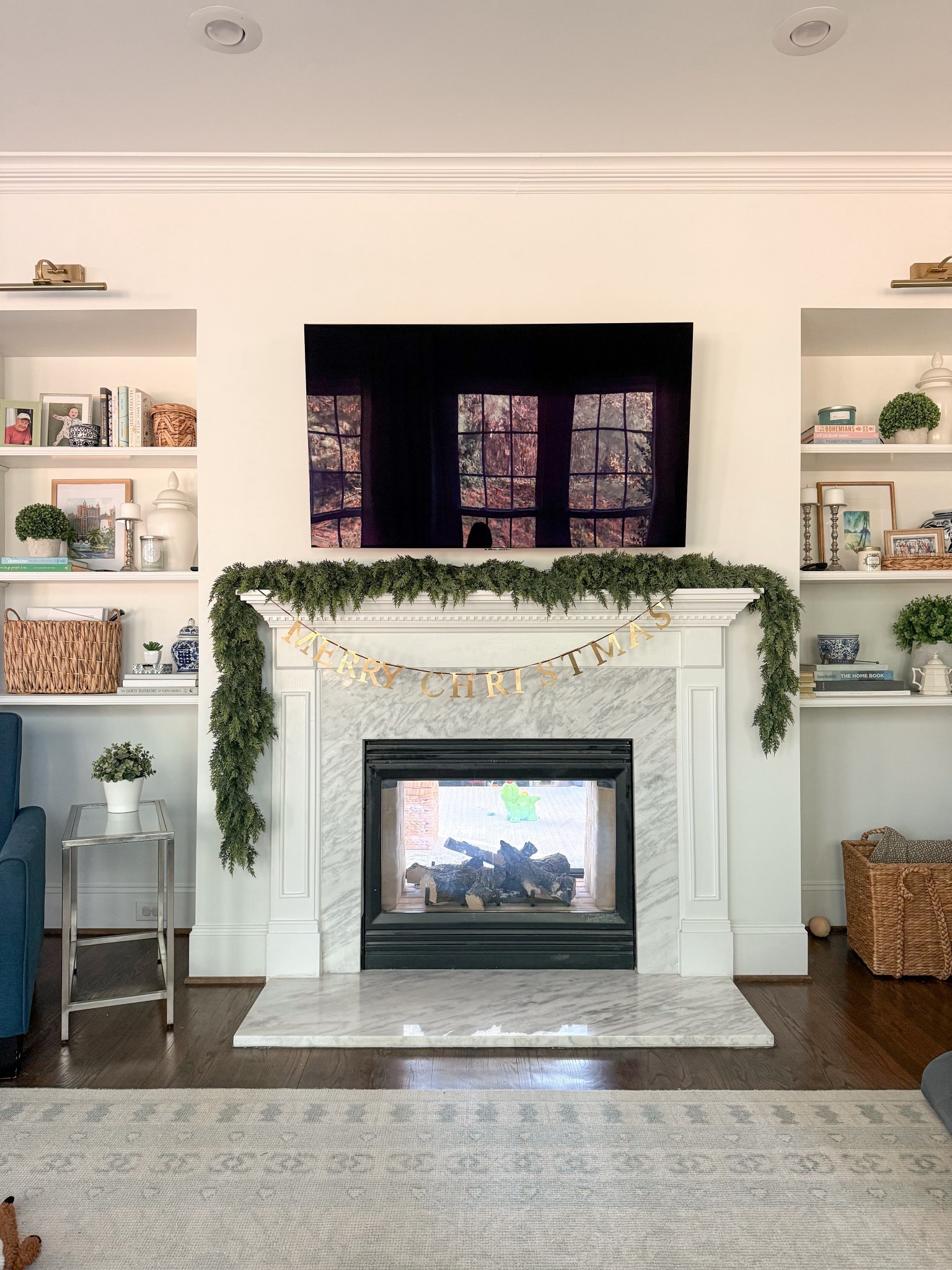 Still working on our Christmas mantel decor - so far there’s two garlands layered and a brass metal merry Christmas banner. It’s coming along! 🎄

#LTKHome #LTKHoliday #LTKFindsUnder100
