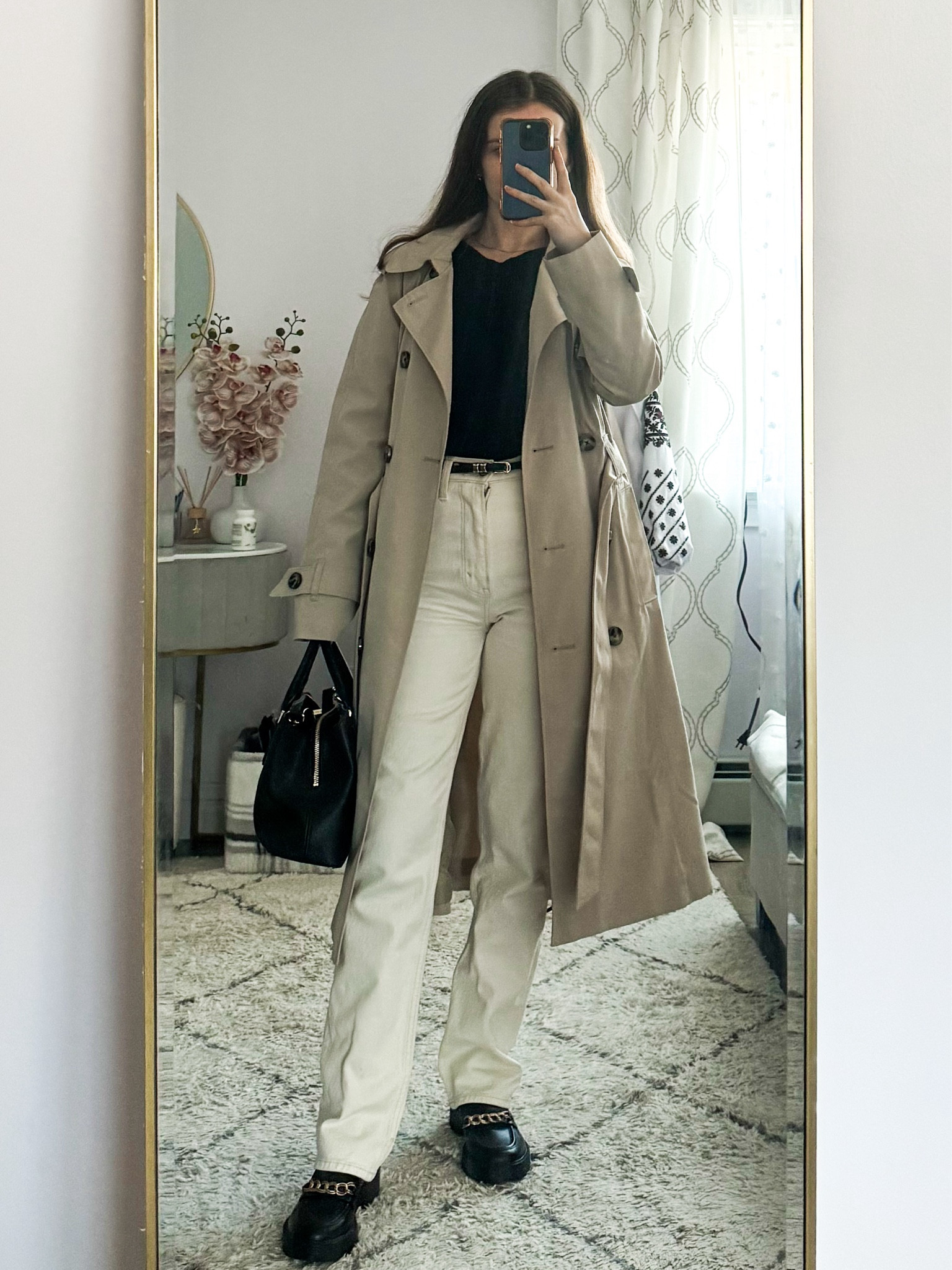 A classic trench coat paired with white jeans, a black long sleeve top, loafers, a sleek belt, and a black work bag is perfect for office days, meetings, or an elevated everyday outfit. 
.
.
.
.
.
.
Winter outfit | winter coat | Trench coat outfits | trench coat beige | beige coat | belted coat | long coat | rain coat | workwear | winter work outfits | jeans outfits | black top |  basic tops | spring outfit | work bag | jeans work outfit | outfit inspo | outfit ideas |  black loafers | chunky loafers | white jeans outfit 

#LTKSeasonal #LTKU #LTKSaleAlert #LTKGiftGuide #LTKWorkwear #LTKTravel #LTKShoeCrush #LTKItBag 



#LTKFindsUnder100 #LTKFindsUnder50 #LTKStyleTip