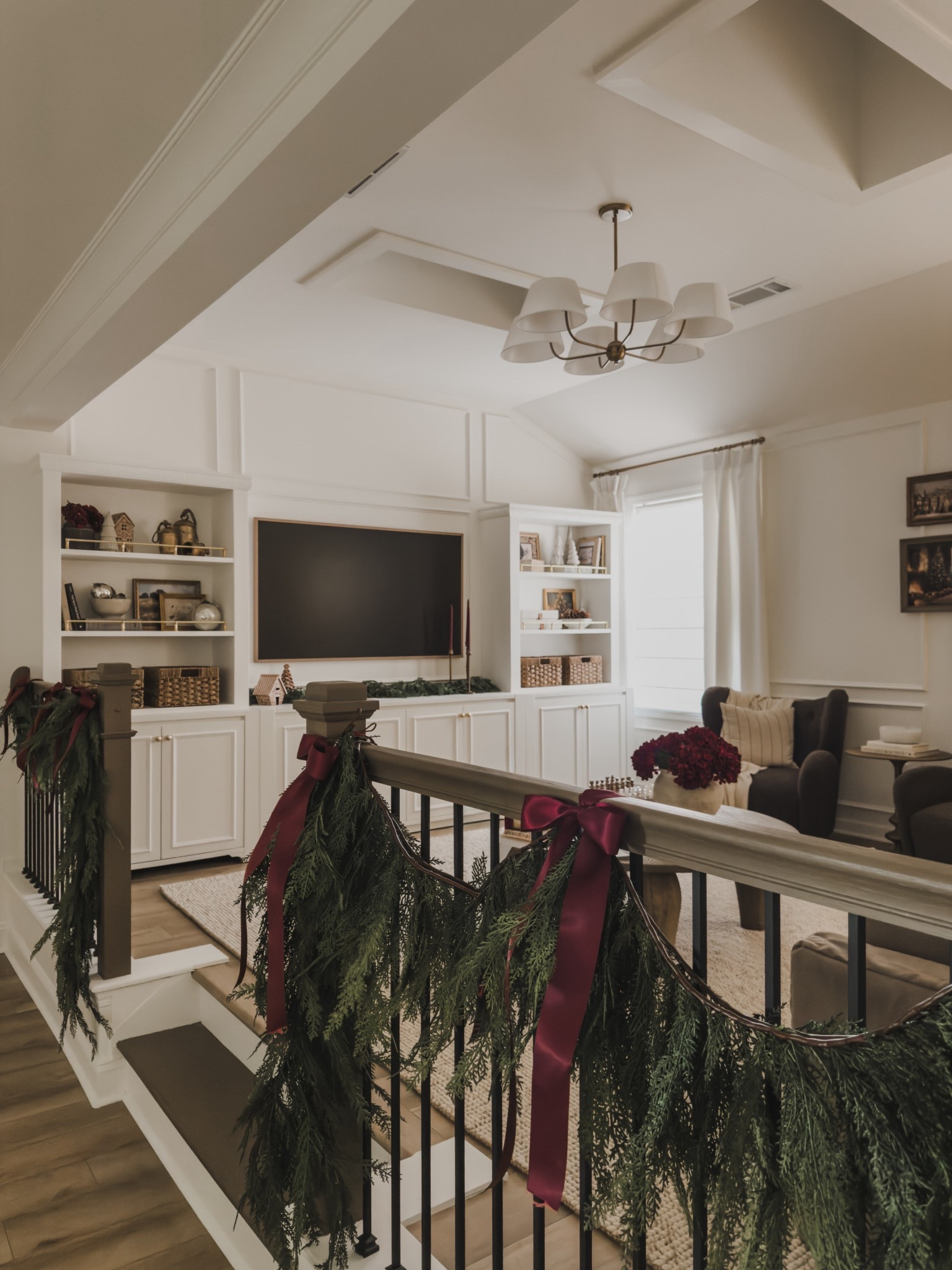 Cozy, collected media center views styled for the holidays! Loving the lived in a functional spaces as this area has evolved!

Home finds, neutral home inspo, furniture favorites, collected style, neutral wood tones, cozy accent chair, neutral area rug, cozy throw pillow, media center style, lighting detail, faux garland, shelf styling, cozy Christmas details, frame tv, found it on Amazon, Wayfair, round coffee table, bow details, shop the look!

#LTKSeasonal #LTKHome #LTKHoliday