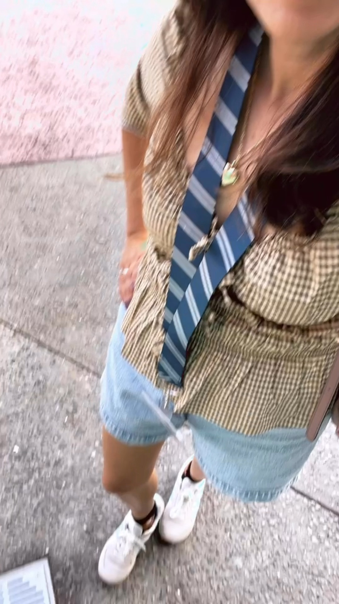 This gingham top is perfect for fall. I love the bow detail for a trendy look.  The tie bows are faux but adds a little more to this top, unfortunately you can’t see them bc of my lanyard.  Wearing comfy shoes and shorts for a theme park look. Theme park outfit,  fall outfit, pumpkin patch outfit 

#LTKHalloween #LTKSeasonal #LTKStyleTip