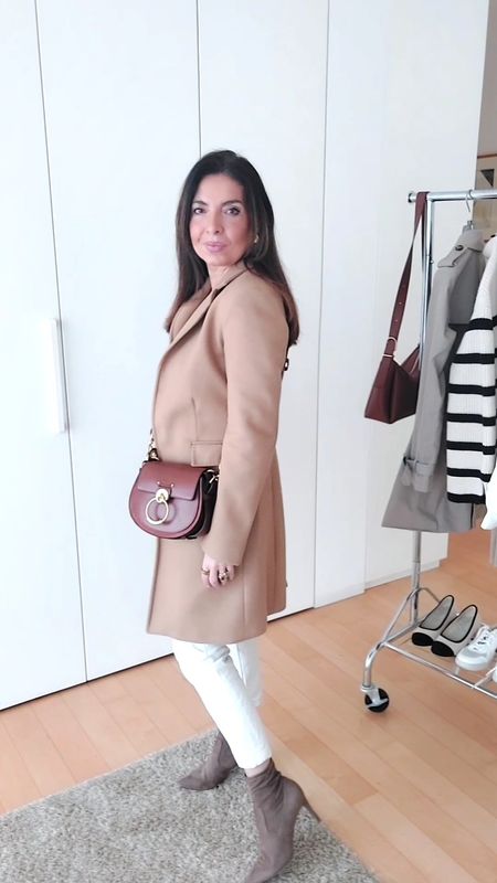 Today I'm wearing an outfit featuring white jeans, a stylish camel coat, nude boots, and the fabulous Chloé Tess bag. Oggi indosso un outfit chic con jeans bianchi, un elegante cappotto color cammello, stivali color carne e la favolosa borsa Chloé Tess. #Fashionista #OOTD #ChicStyle #CamelCoat #ChloeTessBag

#LTKSeasonal #LTKover40 #LTKitbag